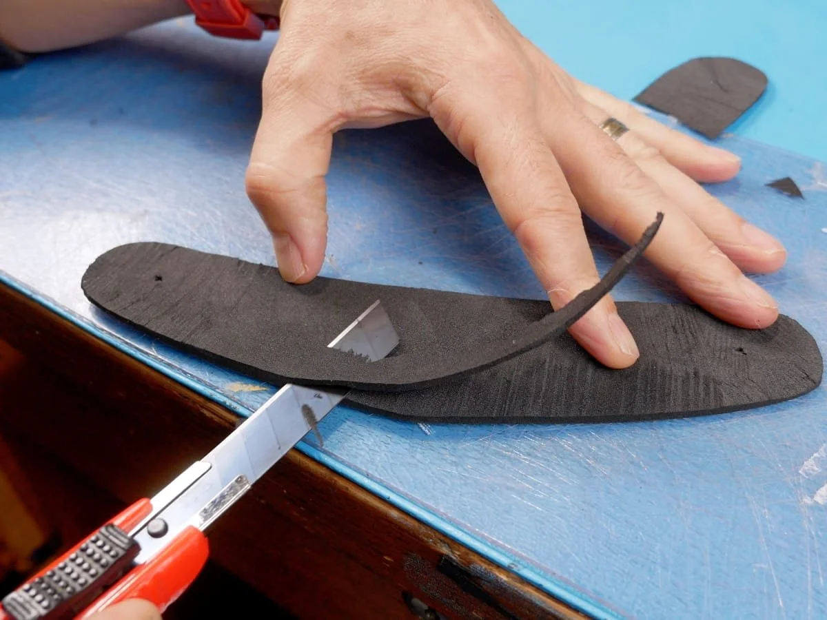 cutting along bottom edge of foam strip