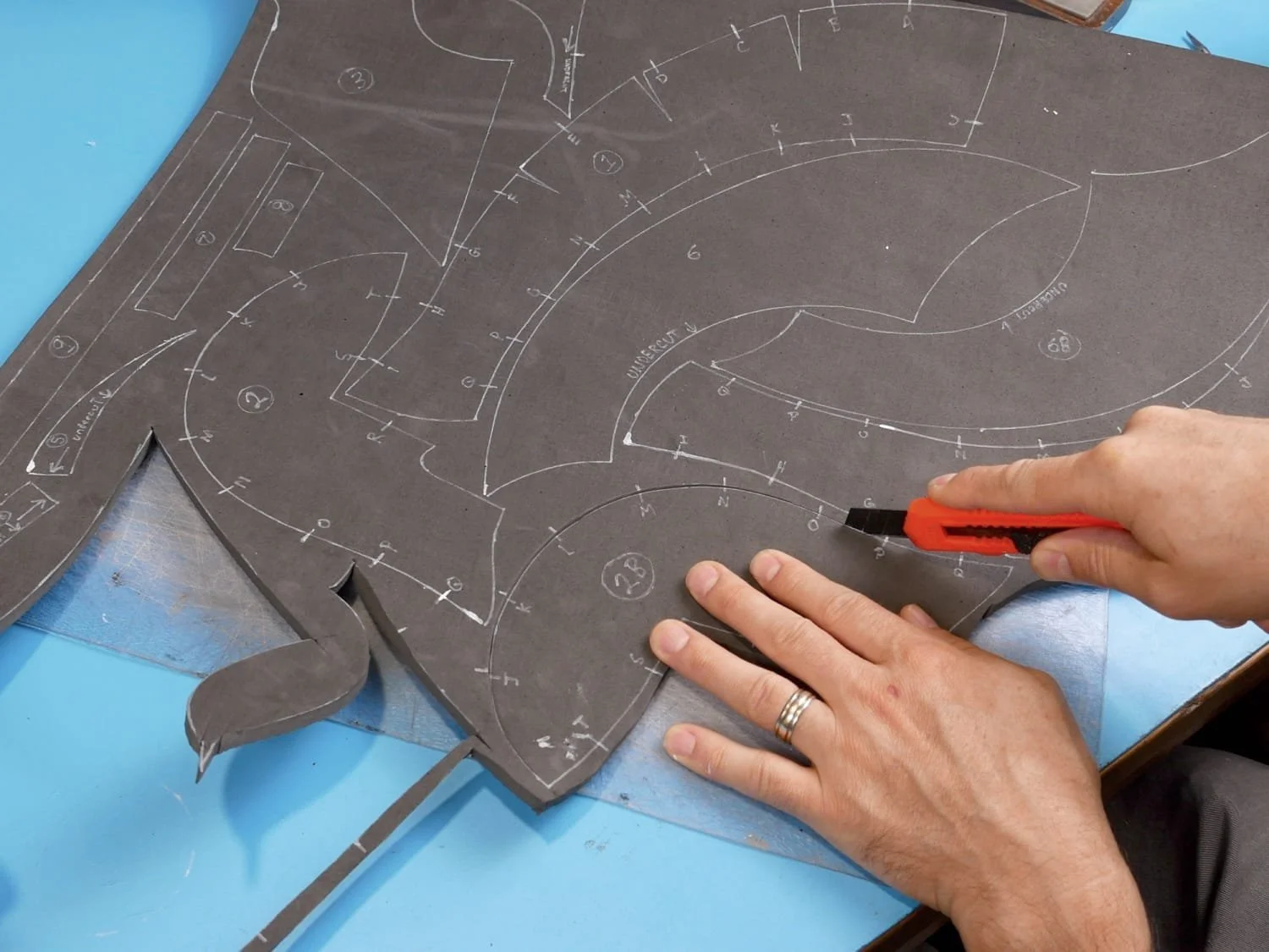 Using a knife to cut out the foam pattern pieces