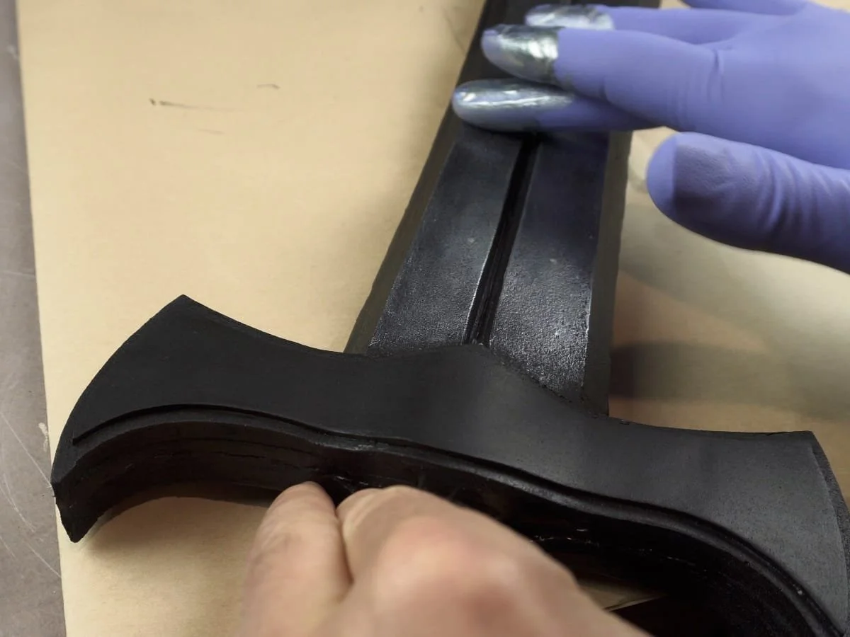 adding silver metallic paint over top of the black paint on the blade