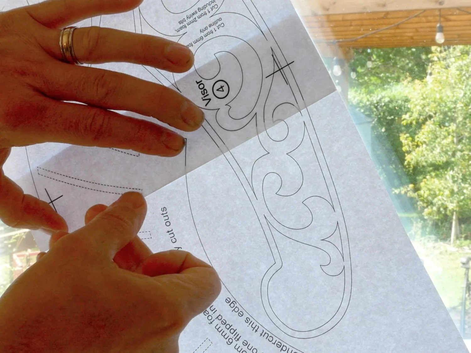 Taping the pattern pages together on a window