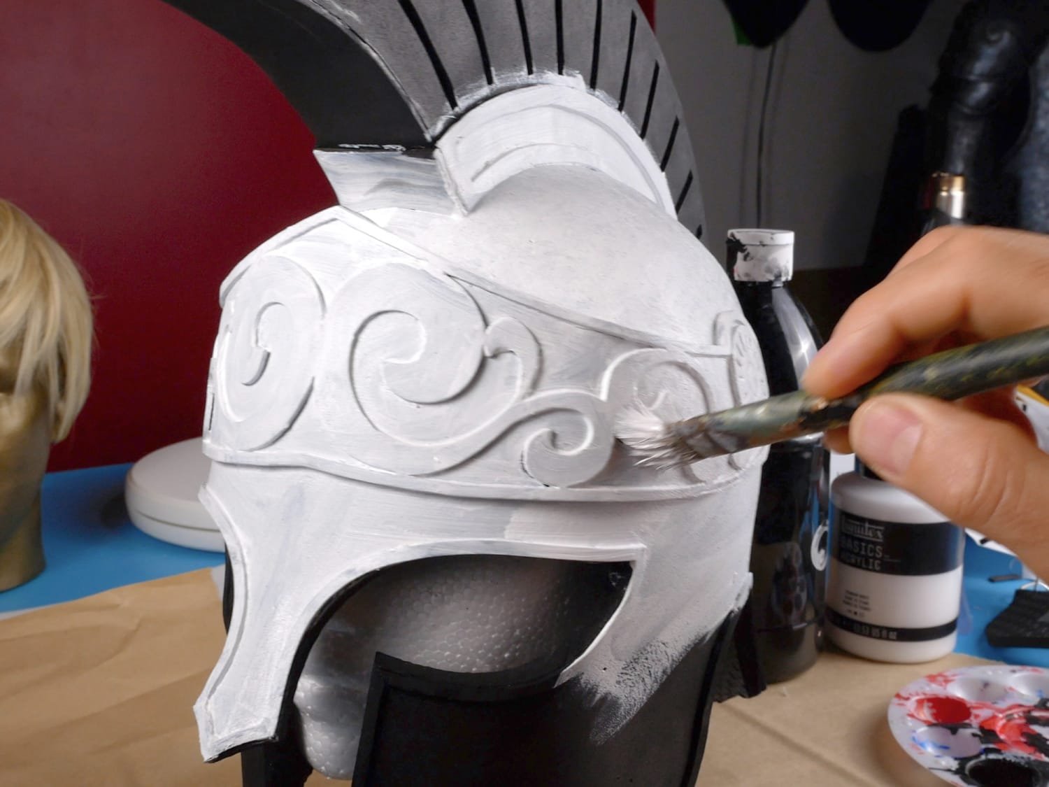 painting a base coat on the helmet
