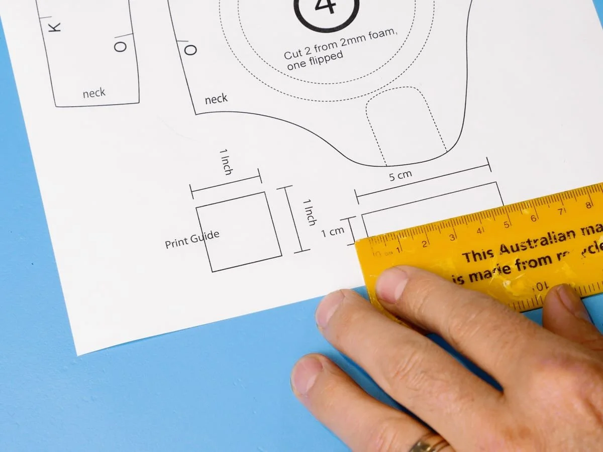measuring the print guides to confirm size
