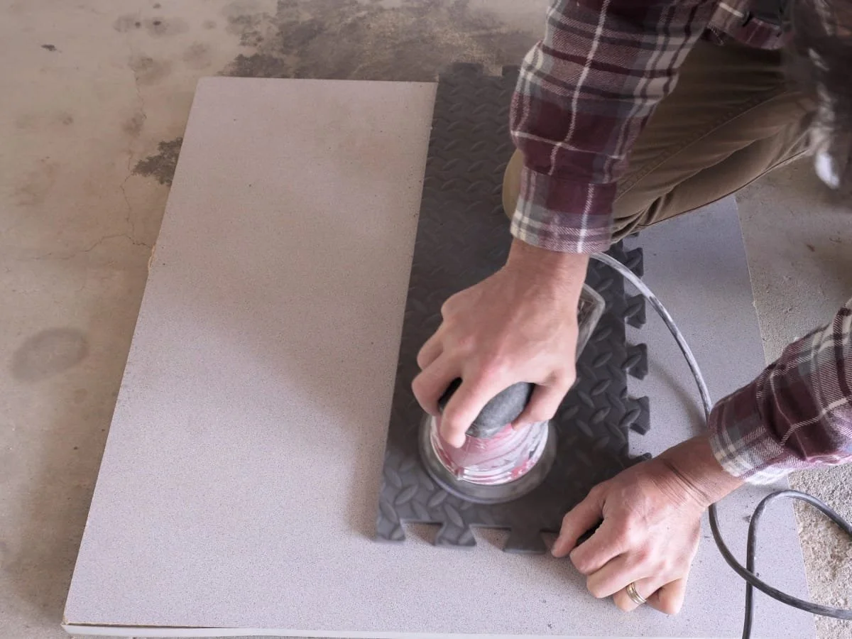 image of using an orbital sander to sand the foam flat