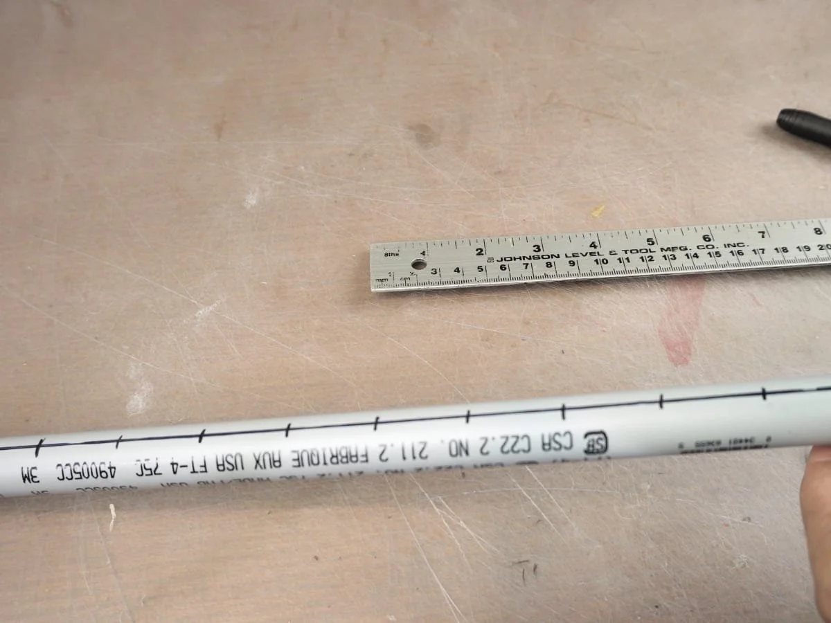 pipe with all the markings for the drill holes