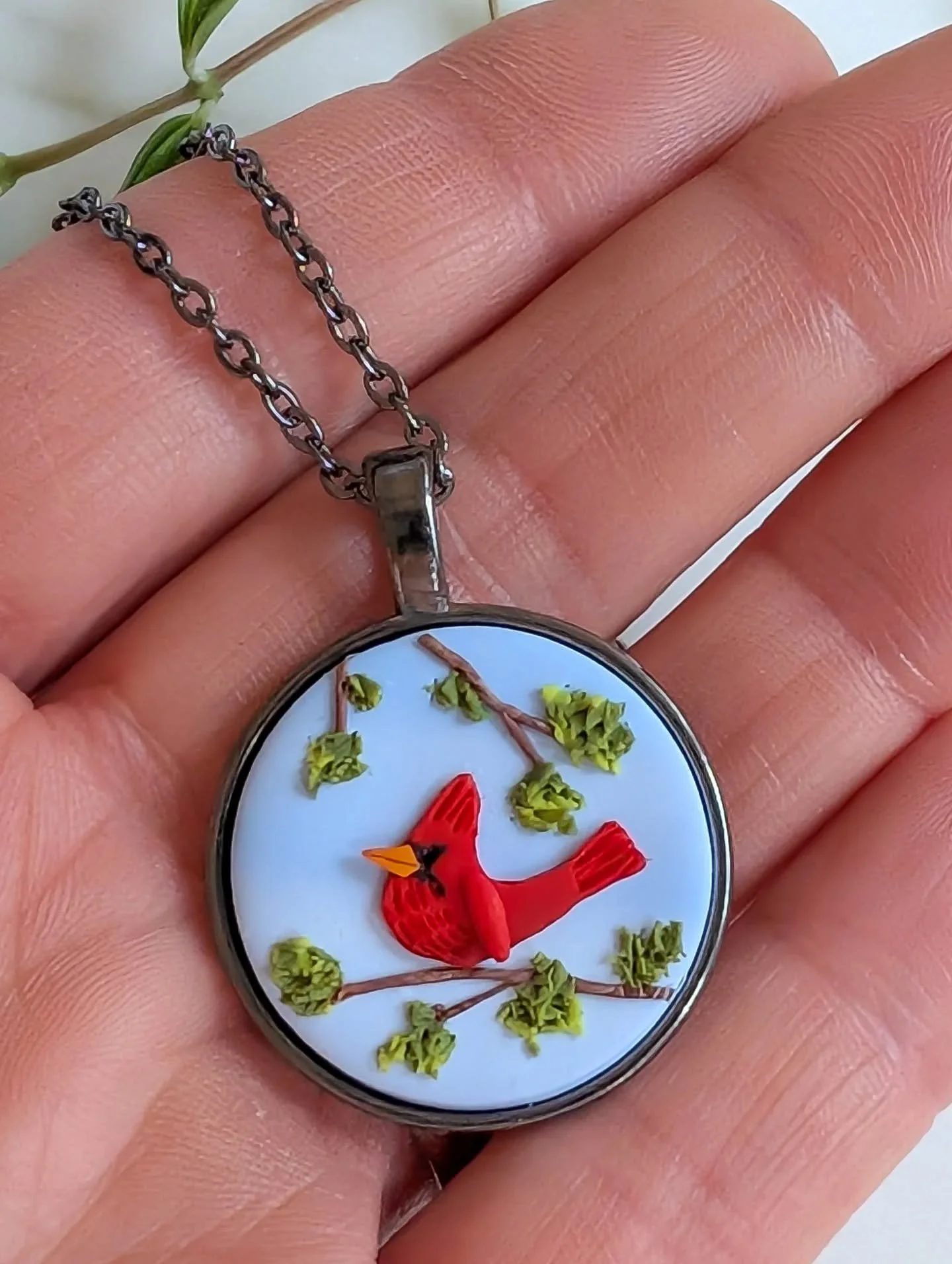 I have a long list of items to photograph and list on my website.... Including this sweet cardinal pendant. 

Spring has arrived and I forgot I have a business to run. I have been obsessively clearing my yard, cutting dead branches, cleaning up piles