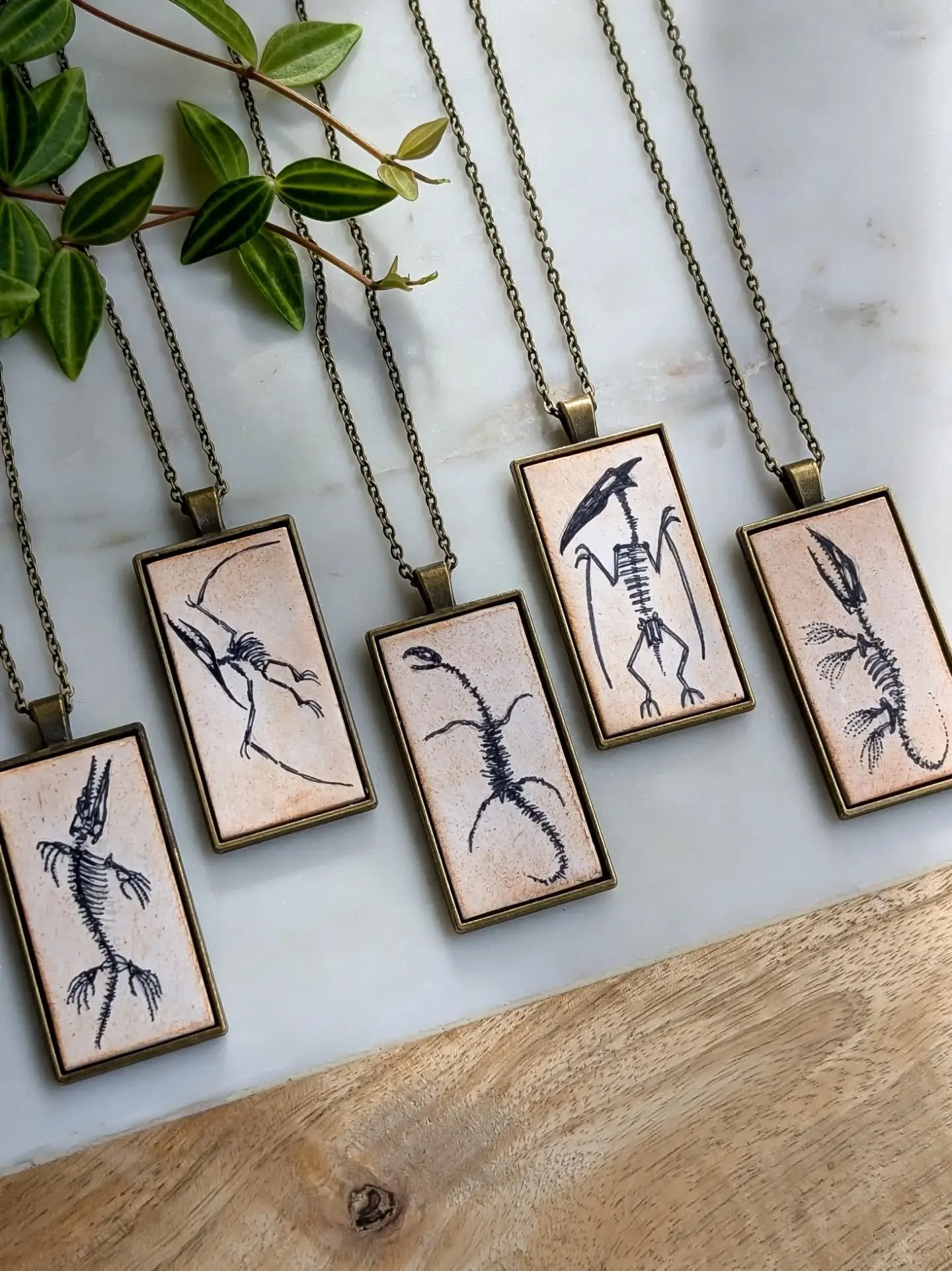 Some new vintage illustration inspired dinosaur pieces are coming to markets and my shop! Currently as pendant necklaces ... could also be earrings! Should they?

Mosasaurs, pterosaurs and plesiosaurs... For now! 🖋️

Dinosaur skeleton | fossil illus