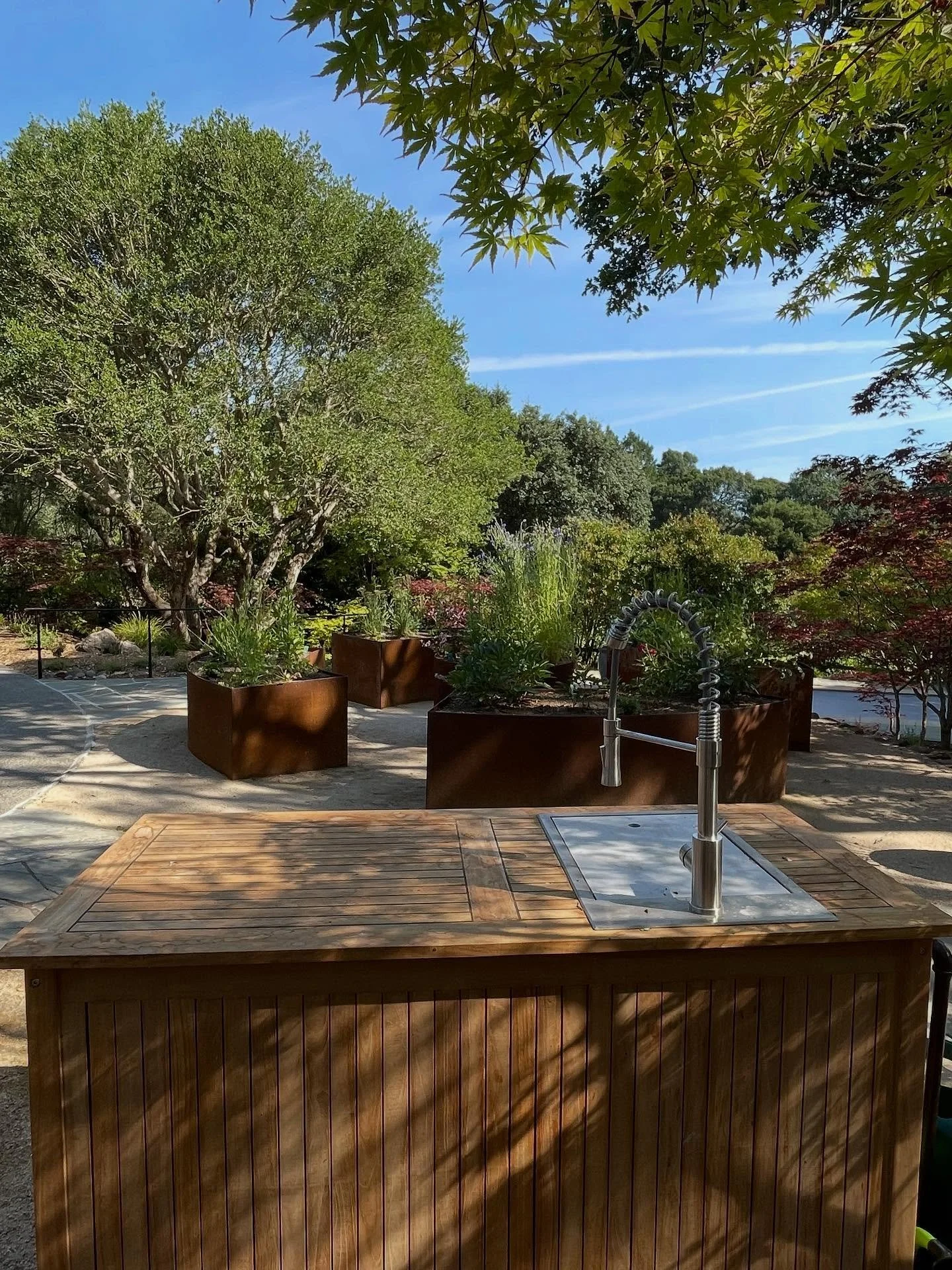 Placing a processing table nearby your cut flower garden makes cleaning and arranging your bouquets a breeze. We also love some hidden storage for compost, tools, soil amendments, vases, and more. This table is teak and will weather to gray beautiful