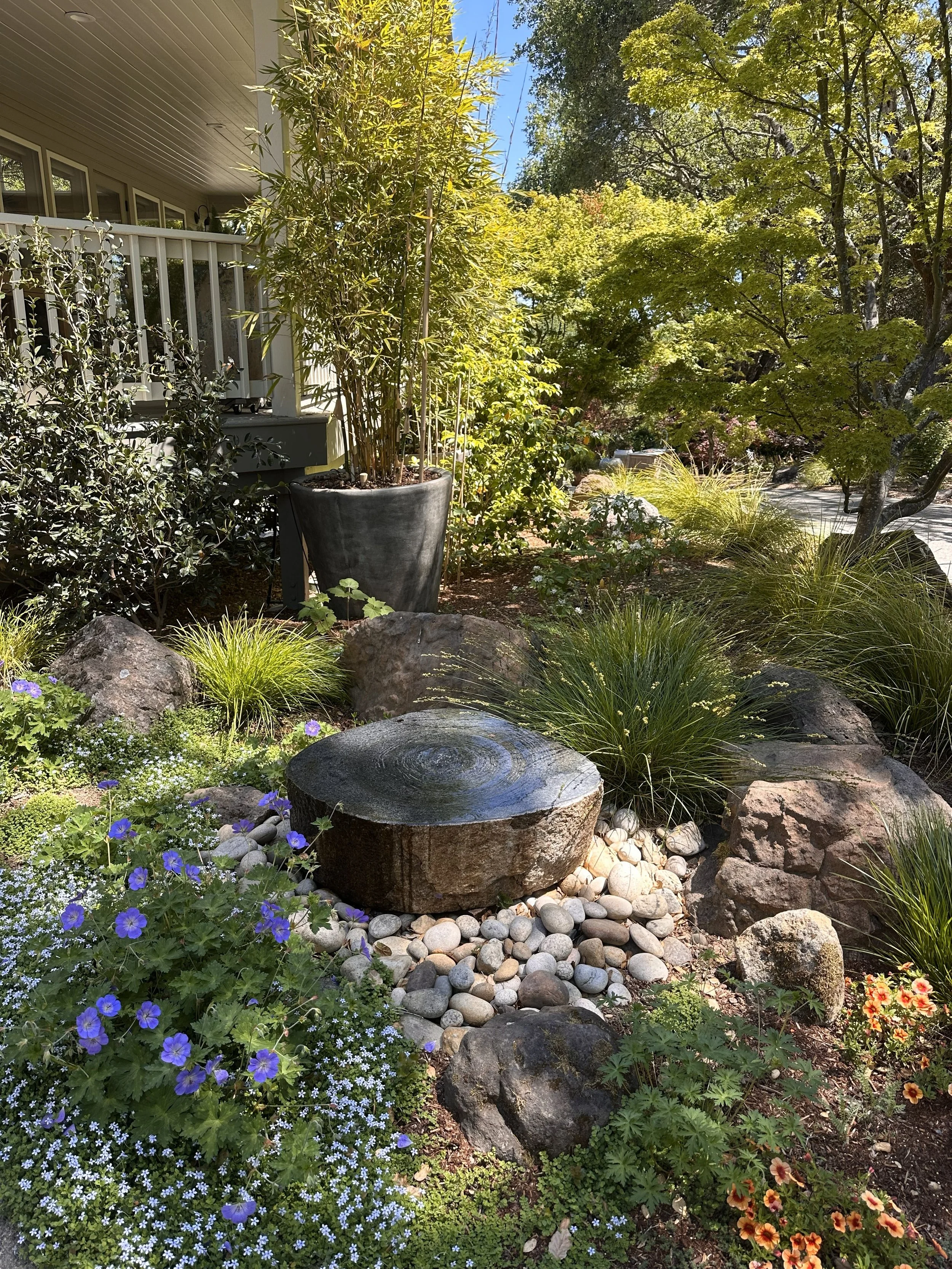 Front entry fountain (recirculating) to welcome people with soothing water sounds