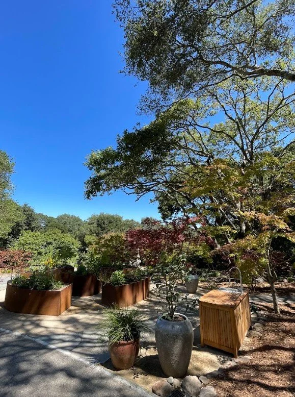 Teak processing table located next to the raised bed cut flower garden for easy bouquet harvesting. Custom outdoor sink installed, plus dedicated hose bib makes clean up easy.