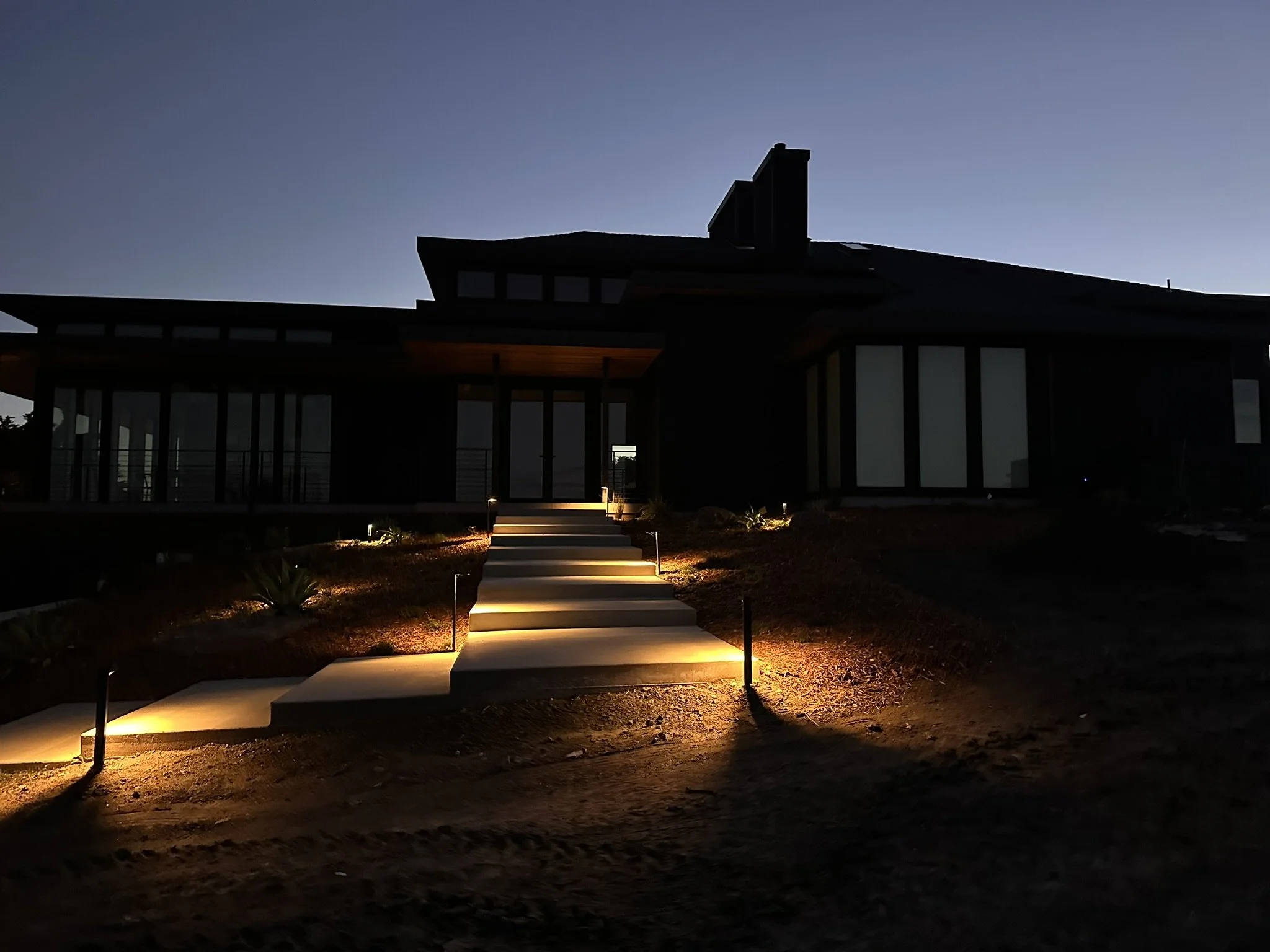 The formal entry to the home is lit with low voltage path lighting 