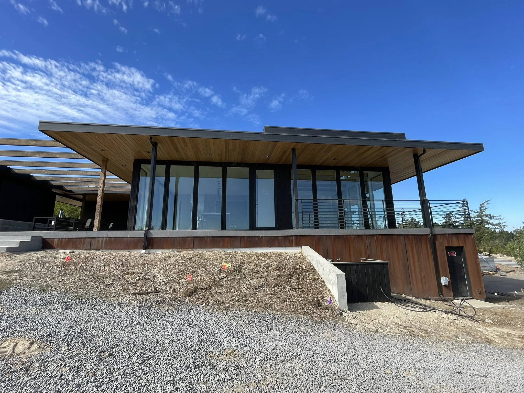 "Before" photo showing the main home approach to be softened and made inviting