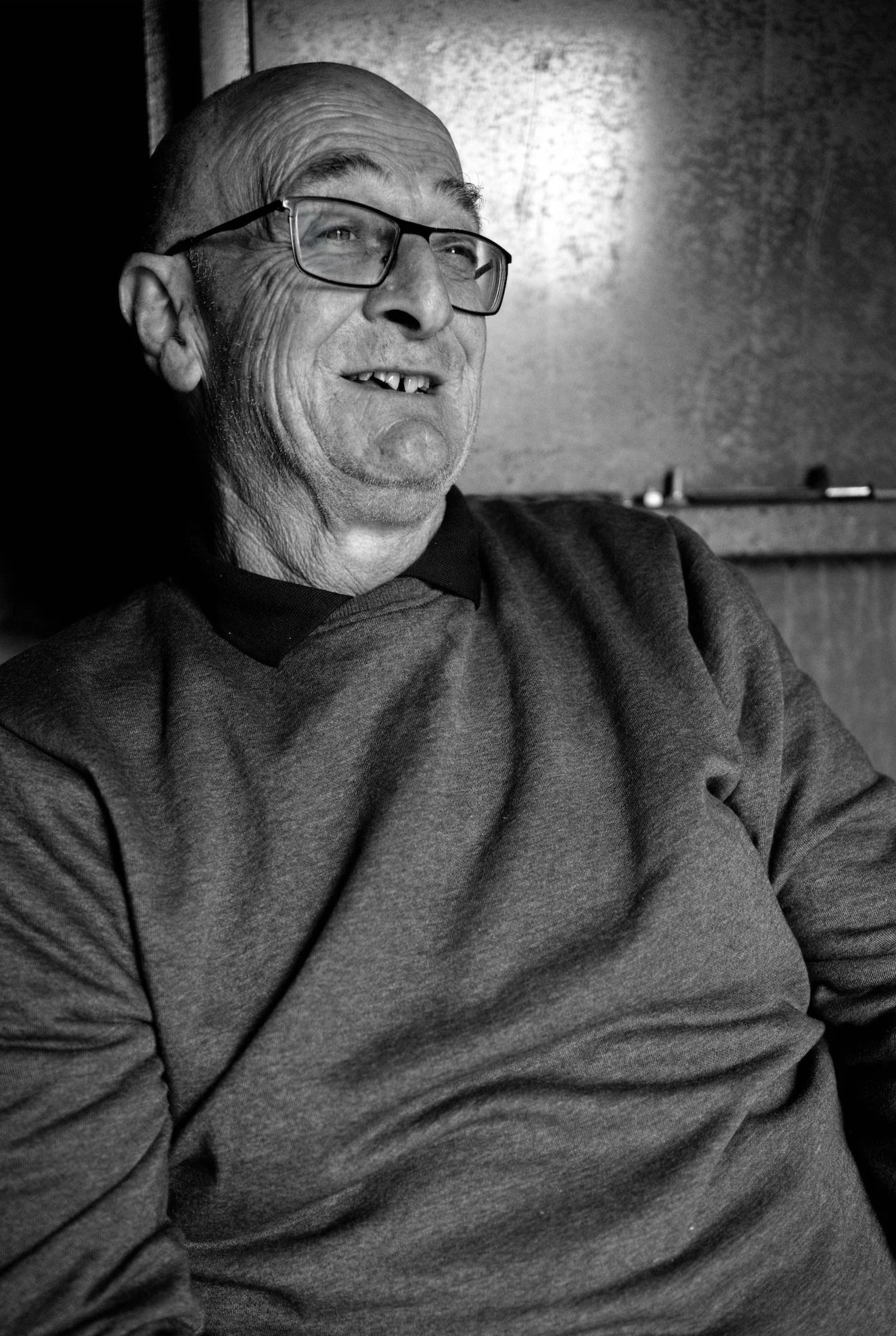 Brian Redmond sits in his workshed