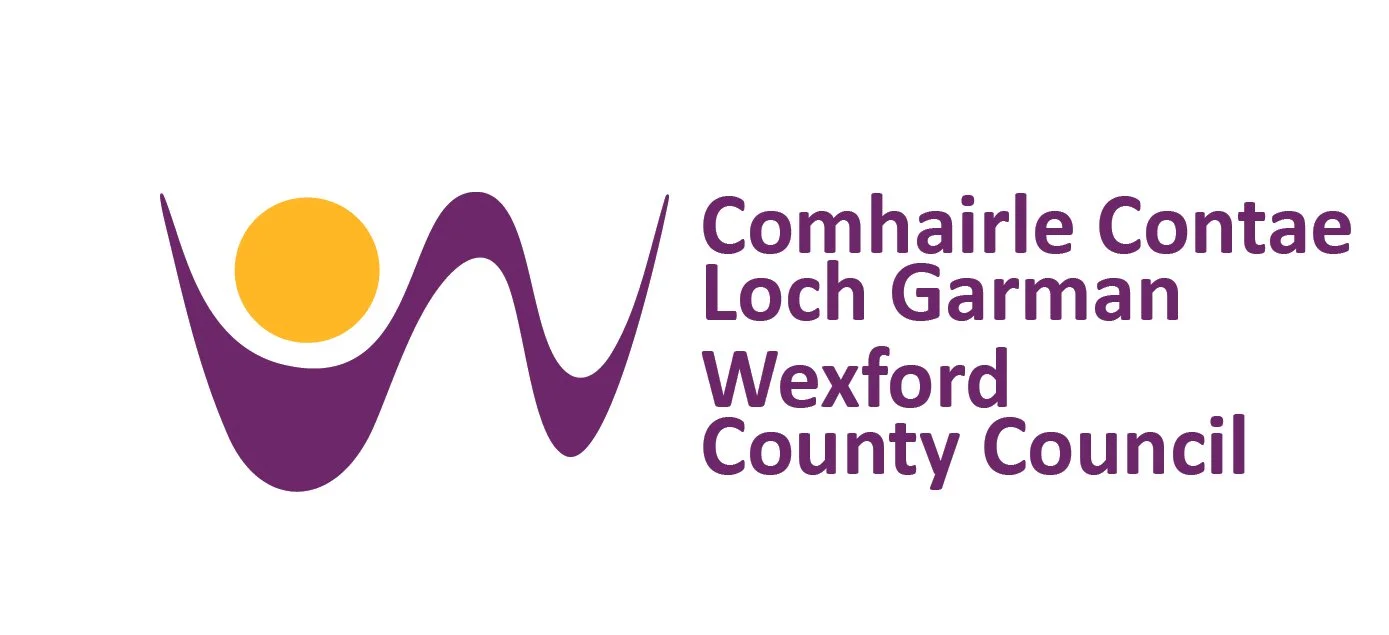 Logo of Wexford County Council featuring a purple wave with a yellow circle and the organization’s name in purple text.