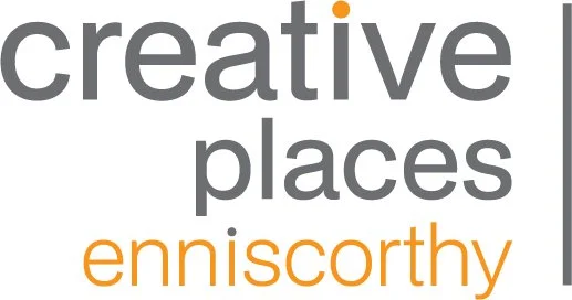 Text with the words 'creative places eniscorthy' in gray and orange fonts.