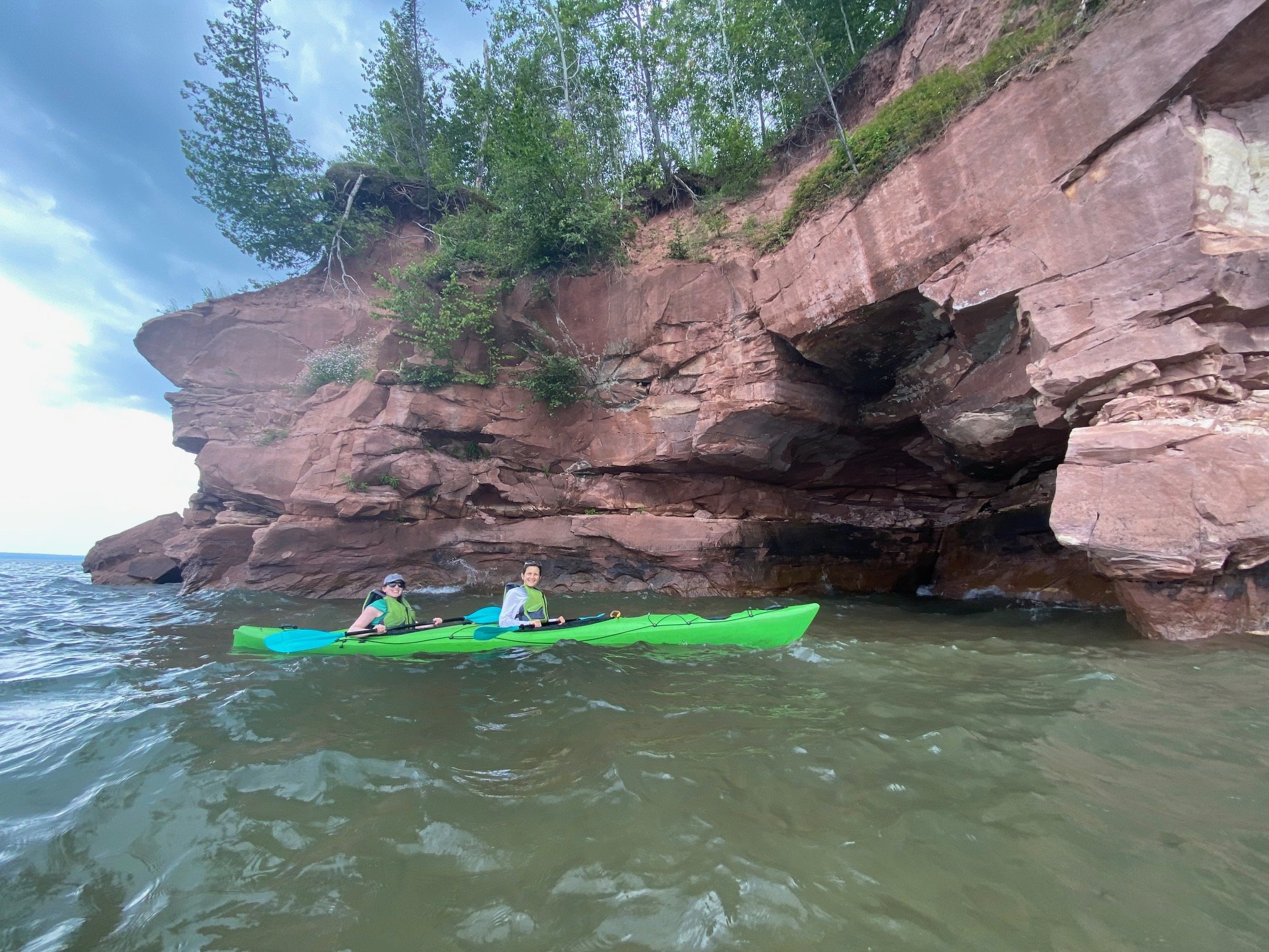  CE Core's Sarah Gollust (back of kayak) adventuring around the caves of Lake Superior with her dearest friend.  