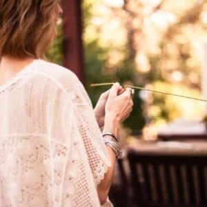 Annette Rugolo holding dowsing rods virtual Diamond Dowsing Club