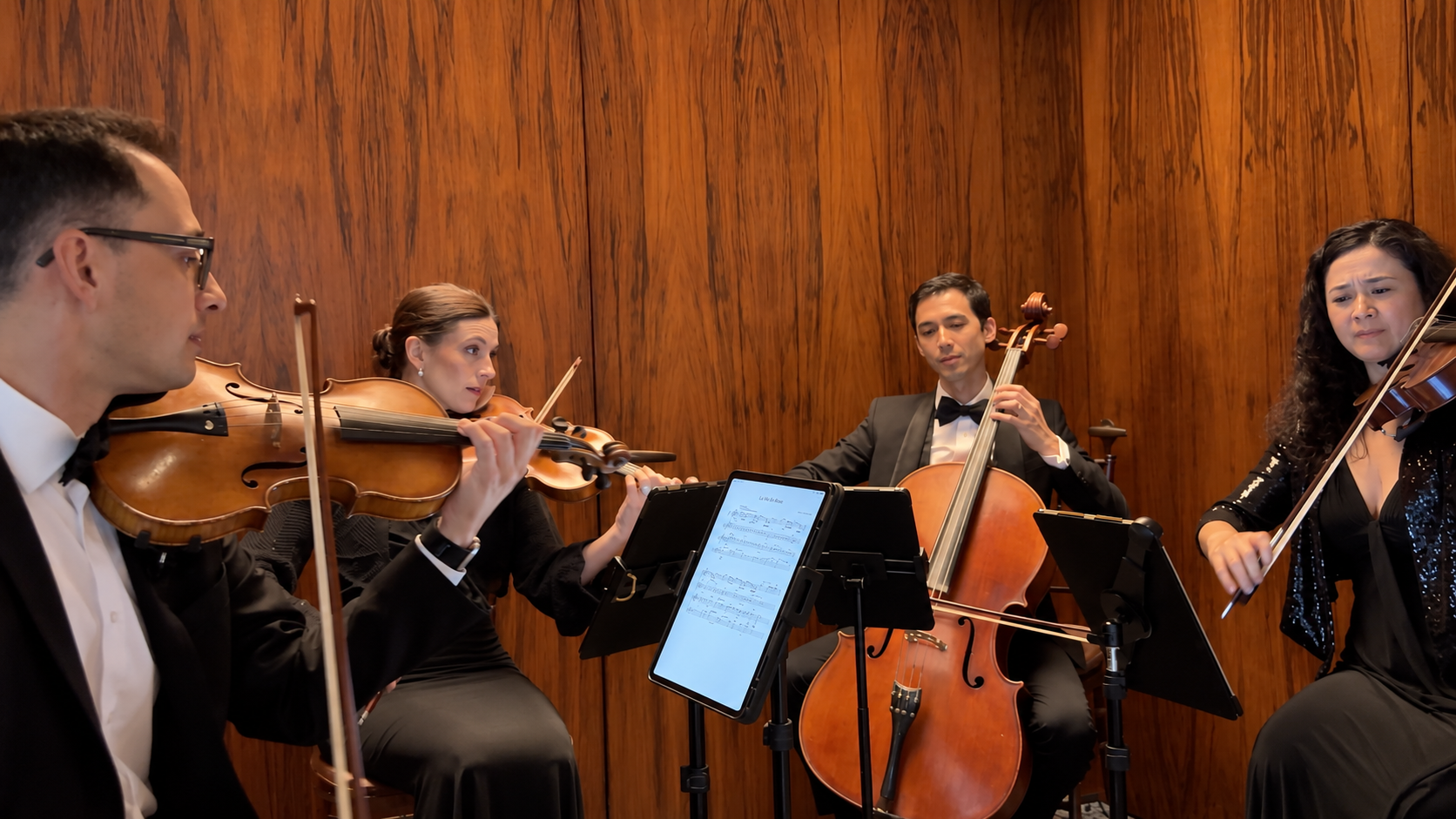 String quartet performing at a corporate dinner at The Pool in Midtown Manhattan, New York City.