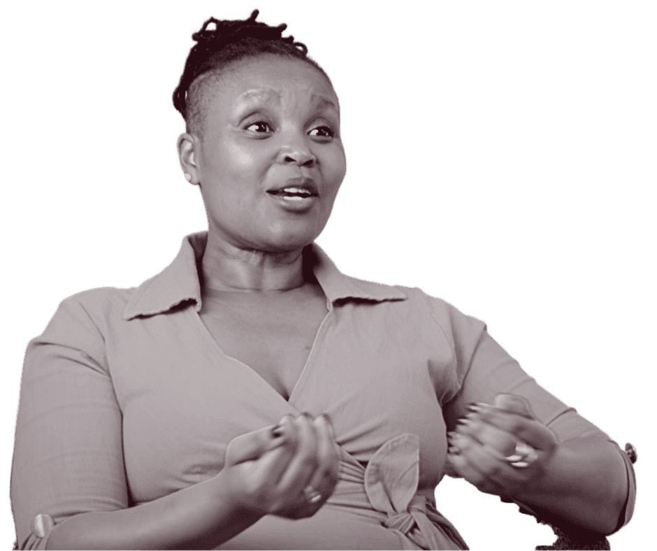 A woman with short hair speaking and gesturing with her hands.