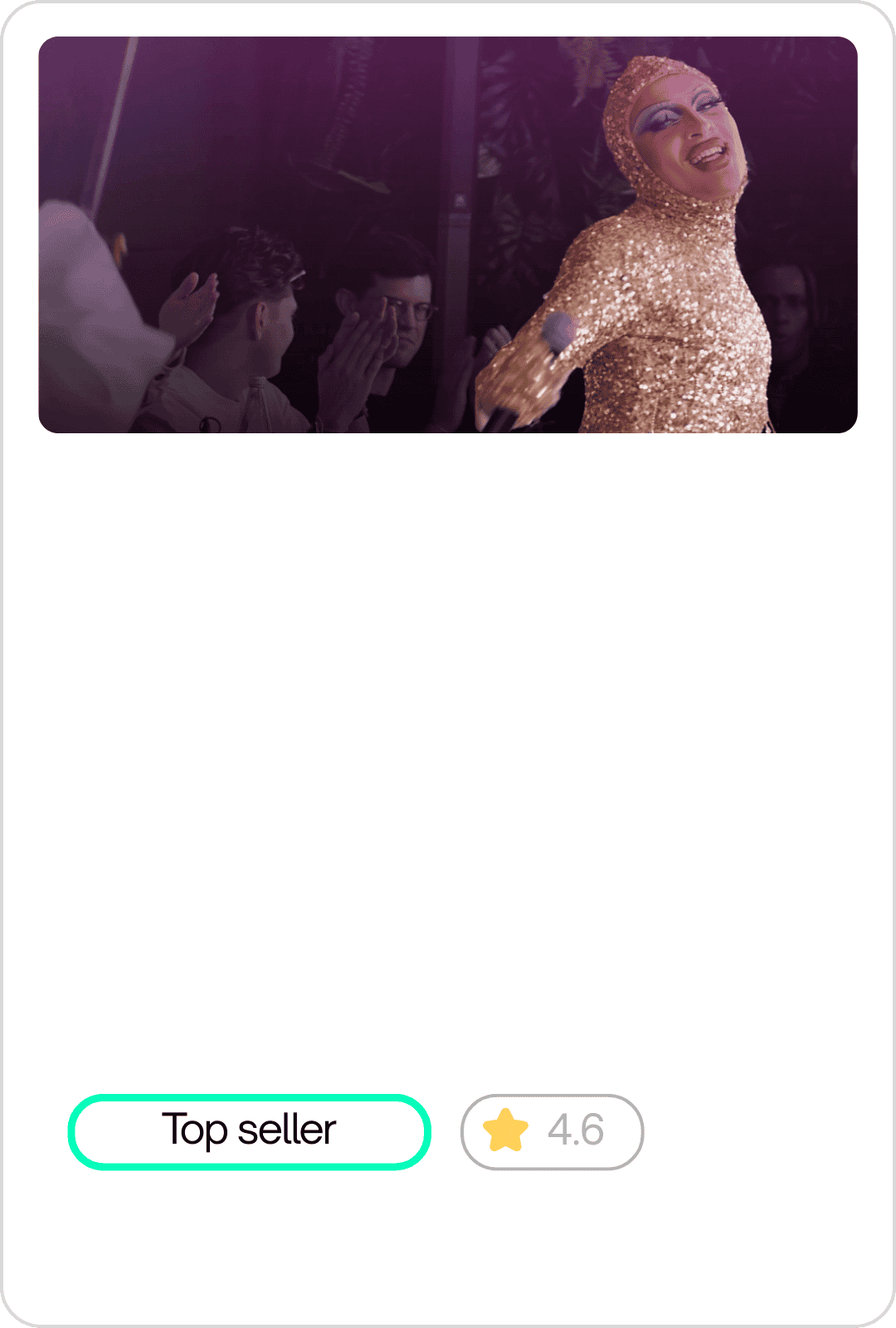 Performer in a shiny gold costume singing into a microphone on stage, with an audience in the background.