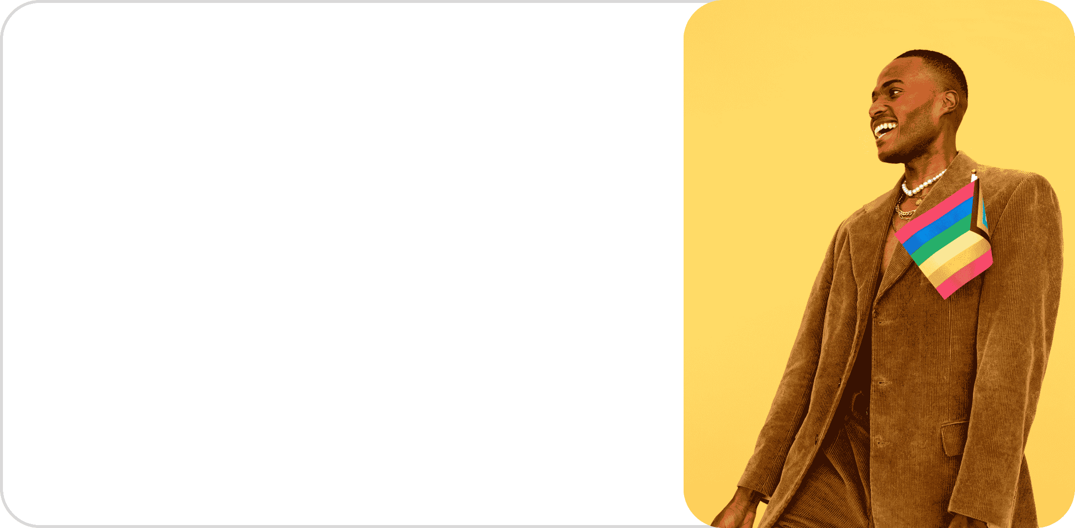 A person smiling, wearing a brown suit with an LGBT pride flag pin, standing against a yellow background.