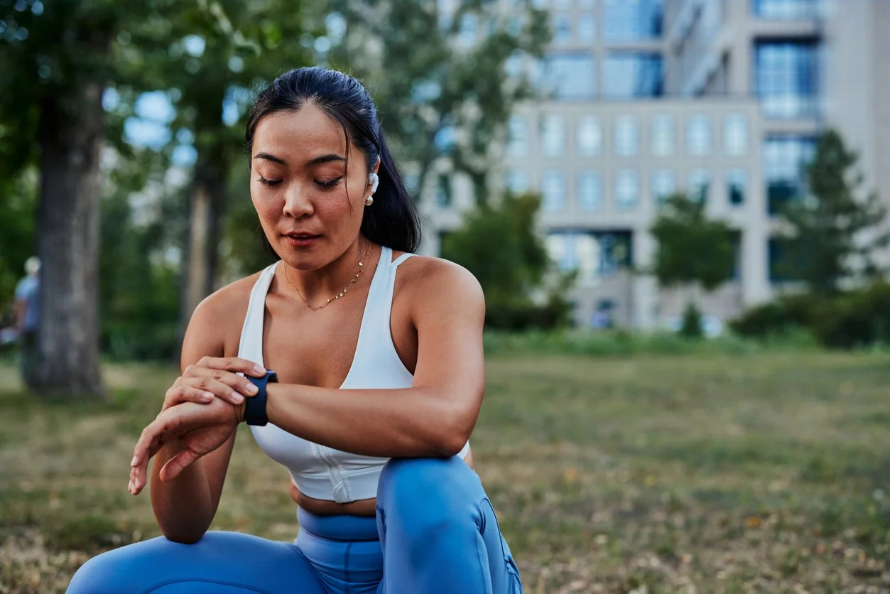 A woman wearing a fitness tracker