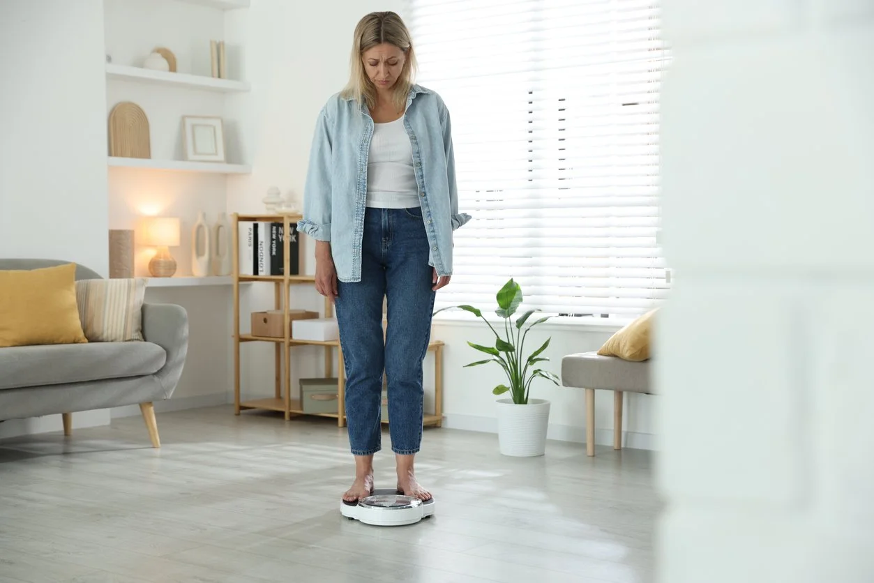 Woman standing on scale