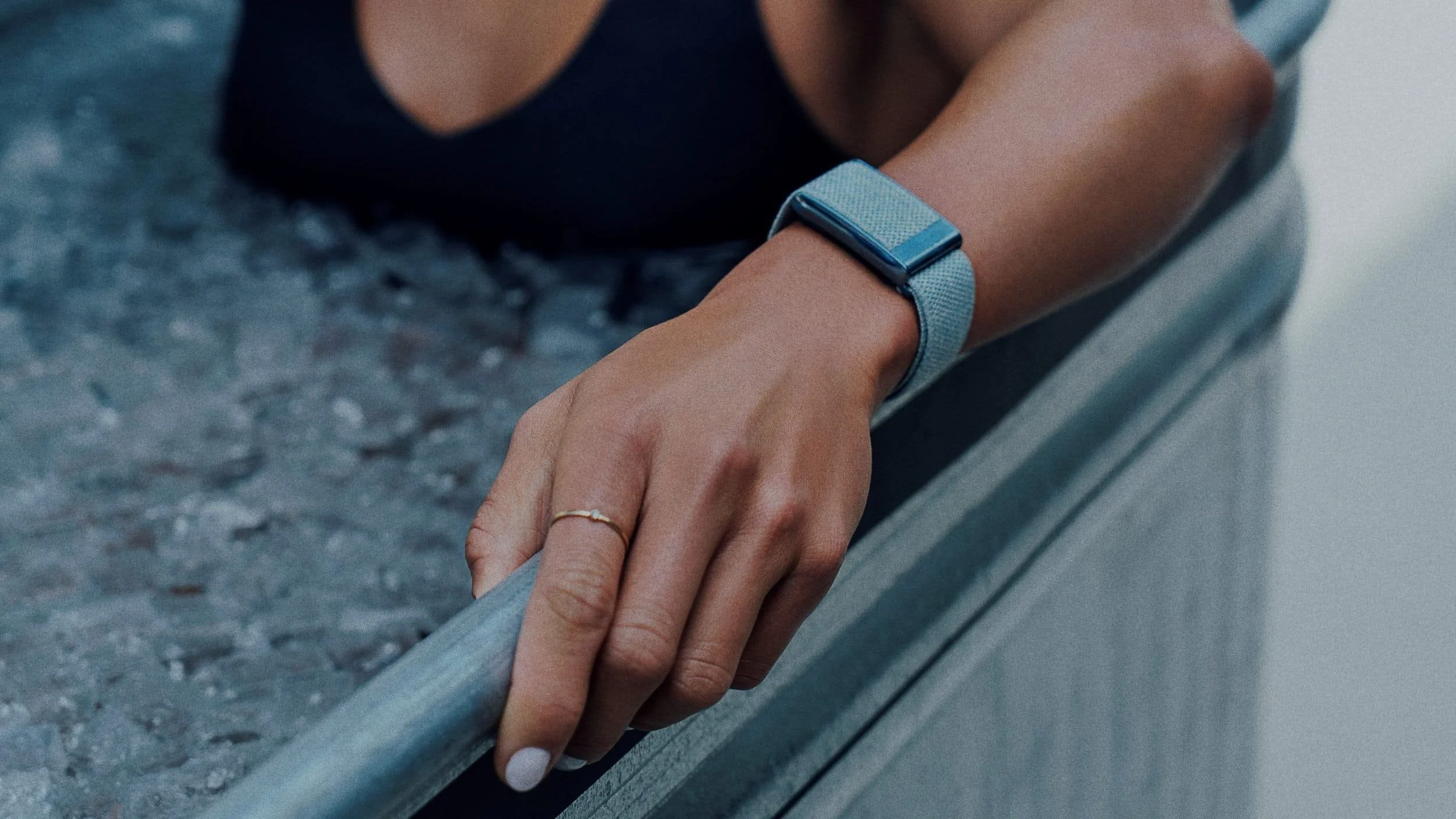 Close-up of a person's arm wearing a smartwatch and a ring