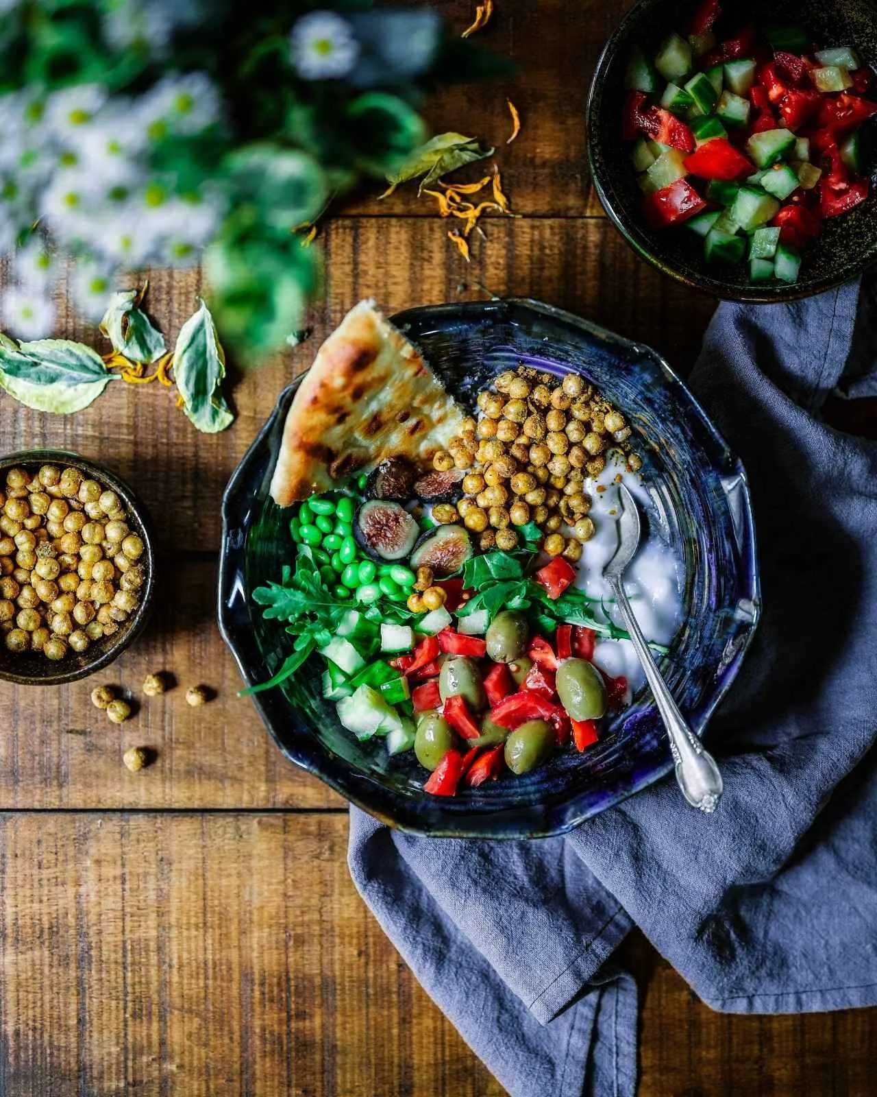 Colorful Mediterranean bowl with chickpeas, olives, and veggies