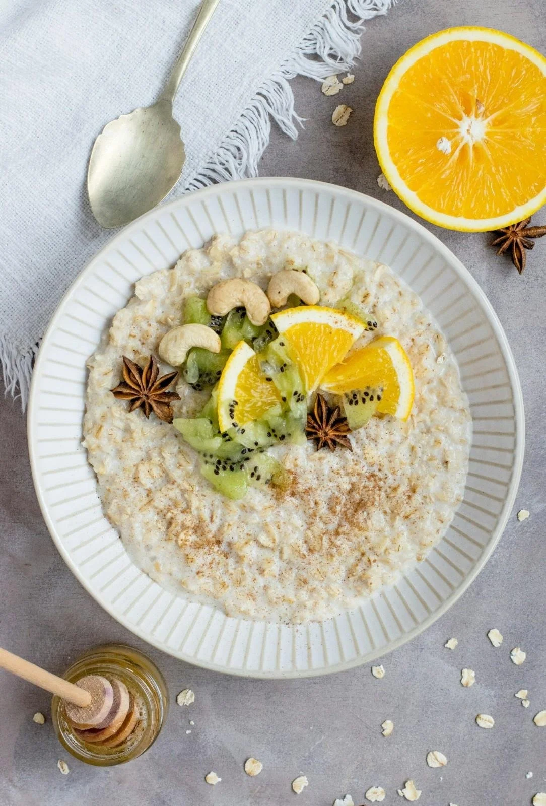 Healthy oatmeal with fresh fruit, nuts, and spices for fiber boost