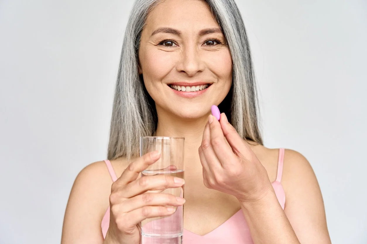 Woman taking a pill