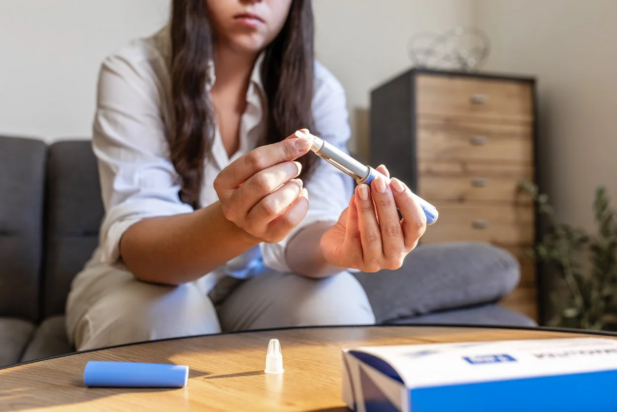 Woman preparing semaglutide injector in the morning