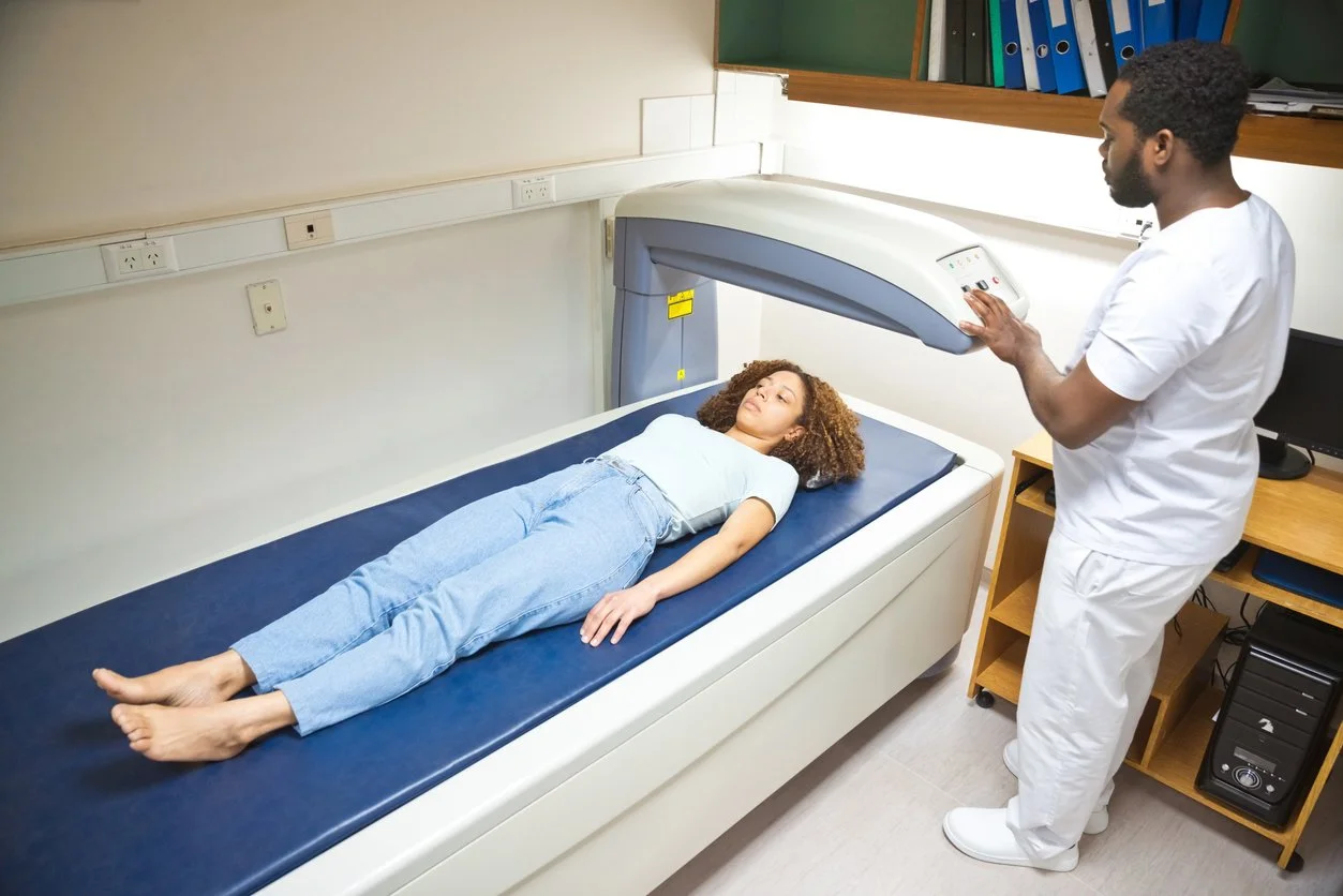 Woman undergoing bone density screening