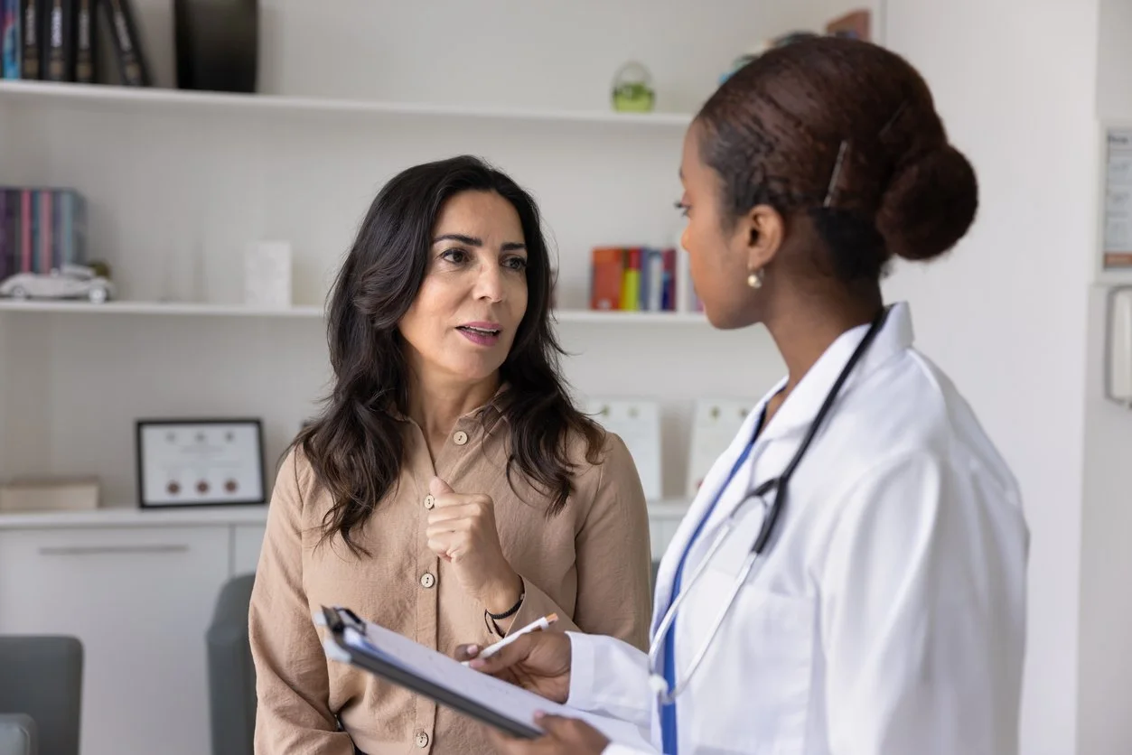 Female patient talking to her doctor