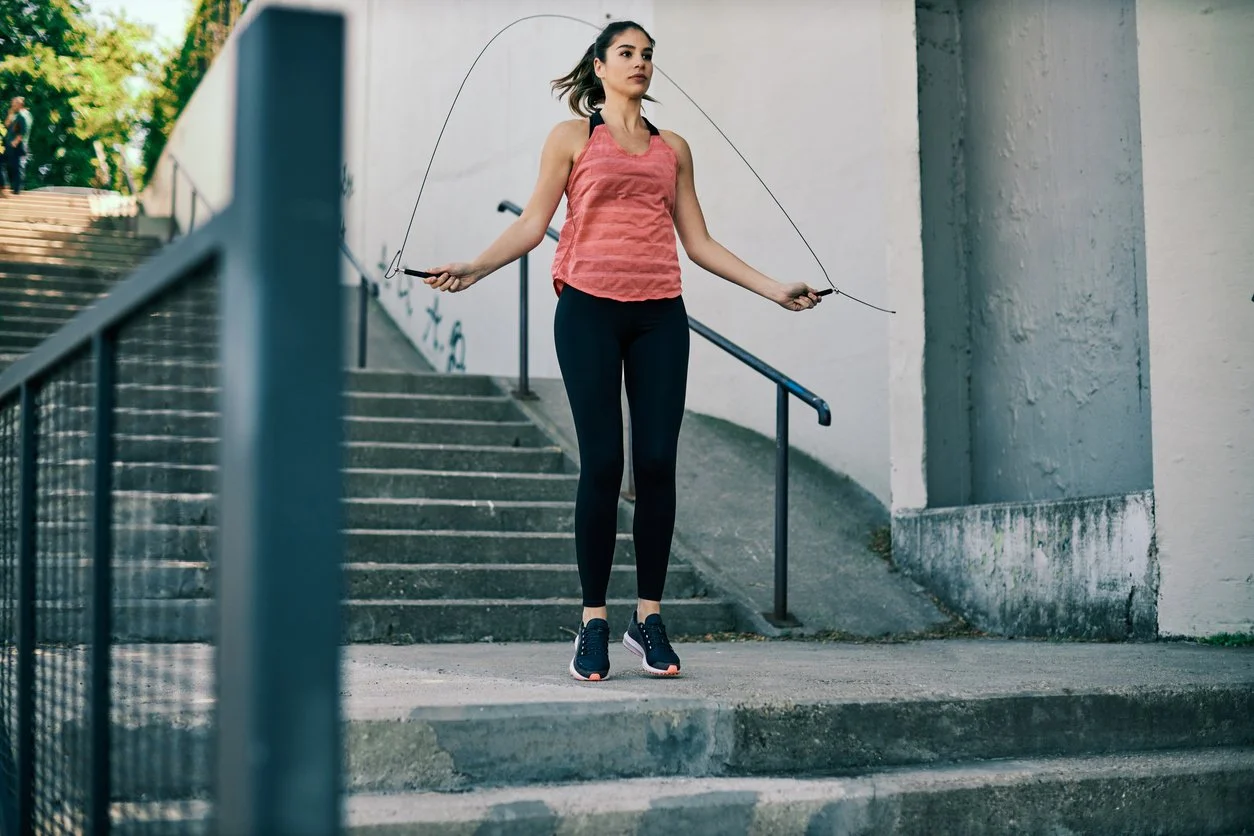 Woman skipping jumping rope