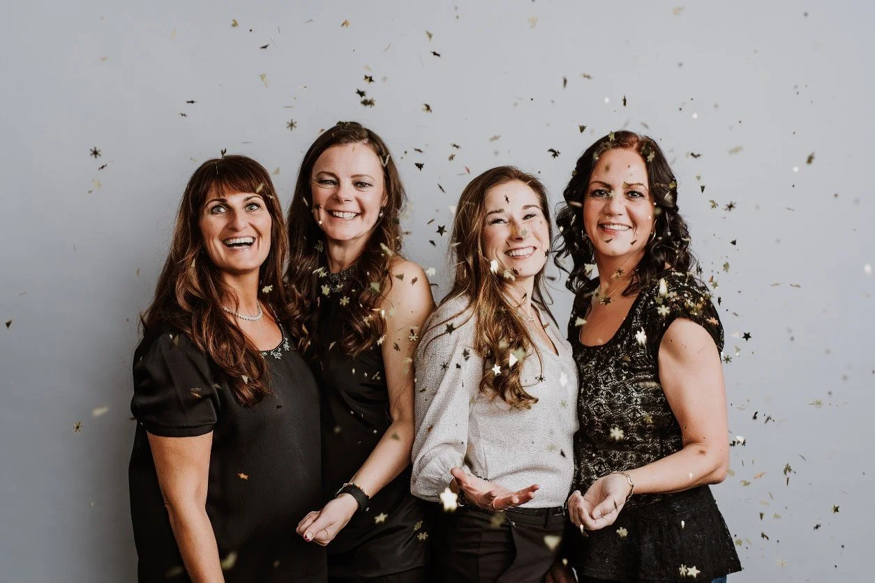 Perimenopause women celebrate with gold confetti in the air