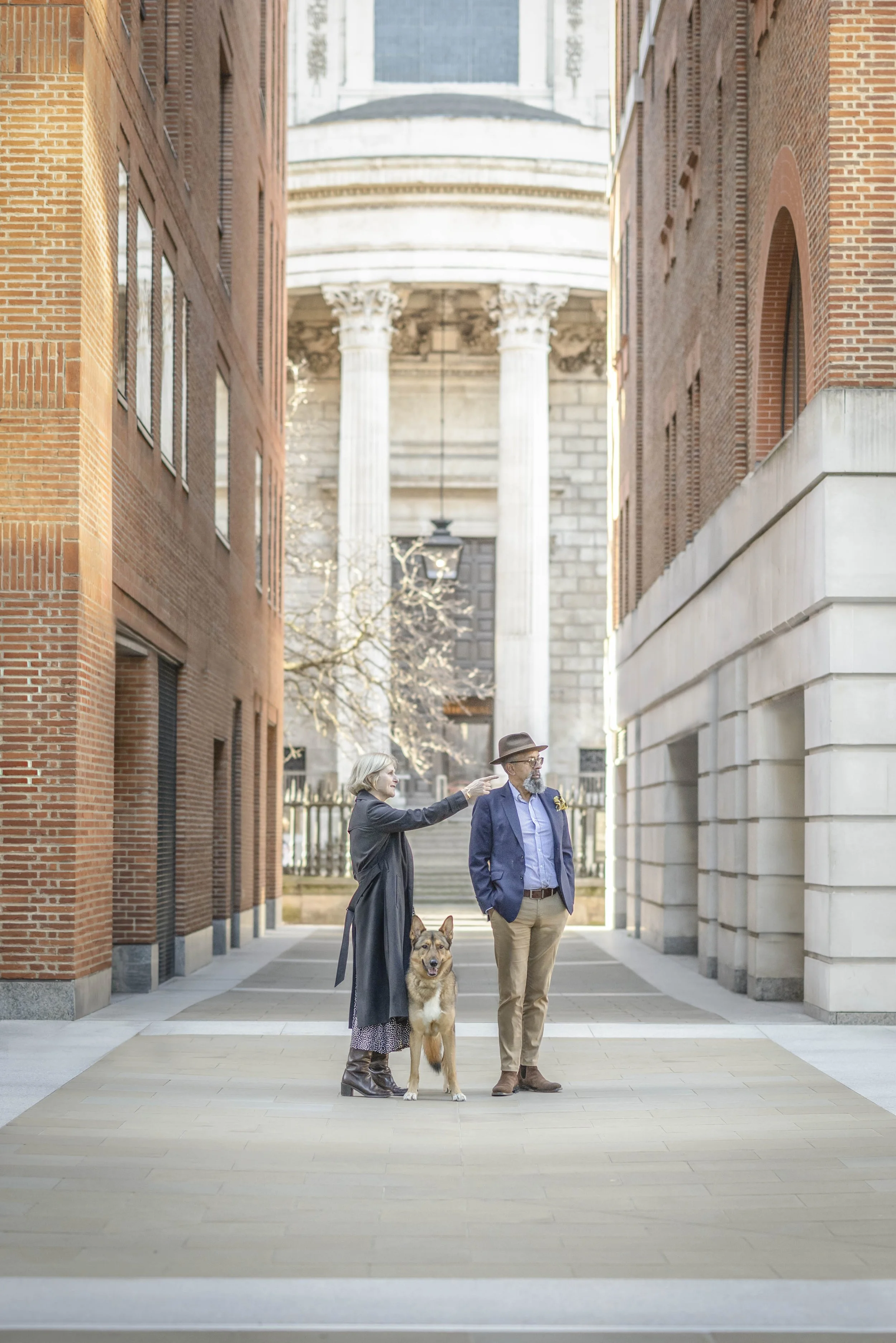 Rescue German Shepherd standing with their owners during a private dog portrait session in London, photographed by Andrew Raven.