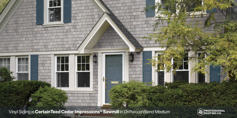 Cedar-style vinyl shake siding in gray on traditional New England home exterior