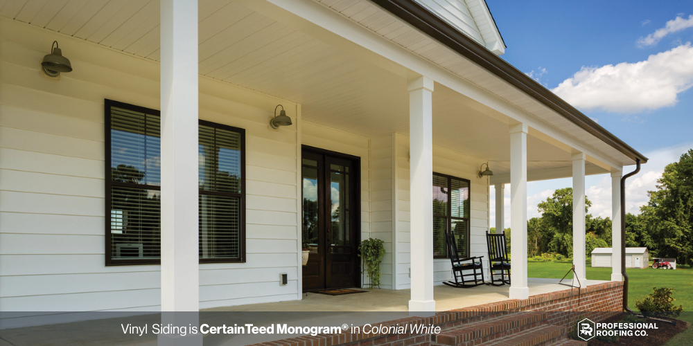 White vinyl siding with modern farmhouse porch and black trim accents