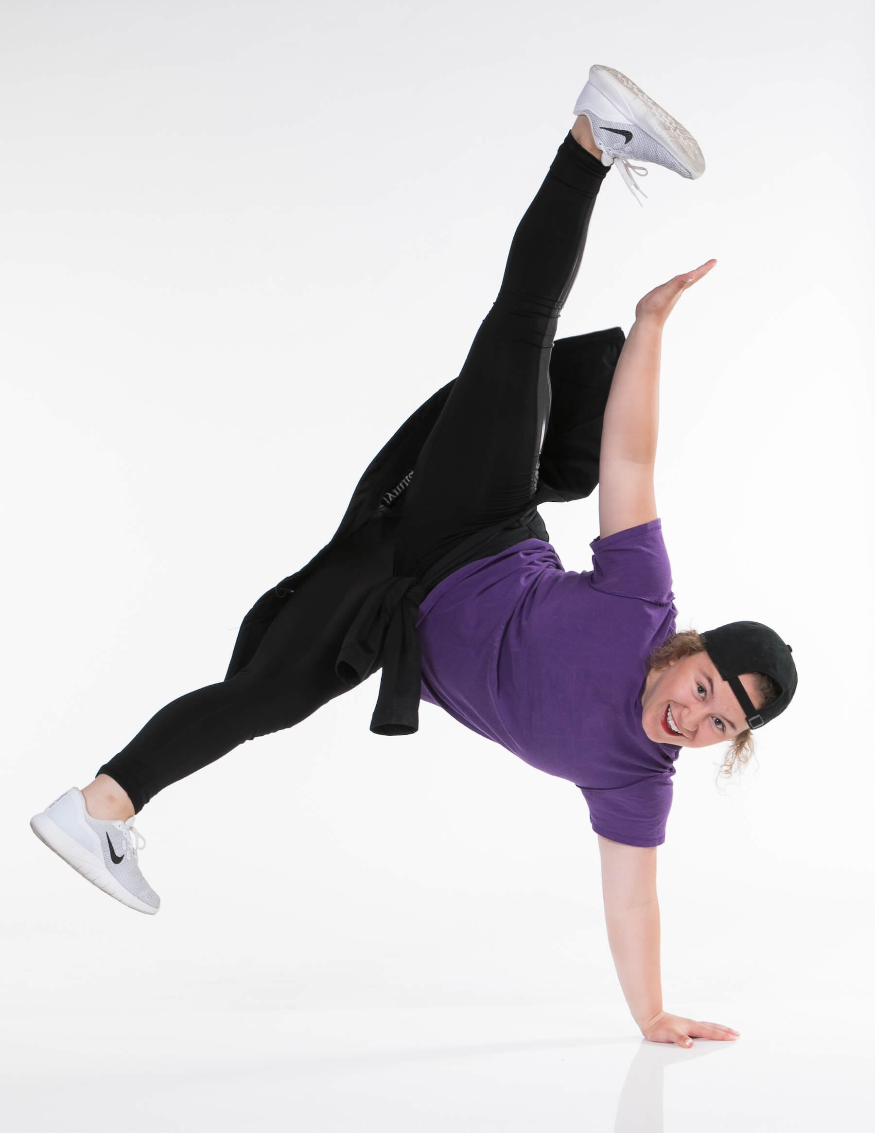 A beautiful young hip hop dancer dancing contemporary urban street dance in  empty clear grey wall background concept. Stock Photo | Adobe Stock