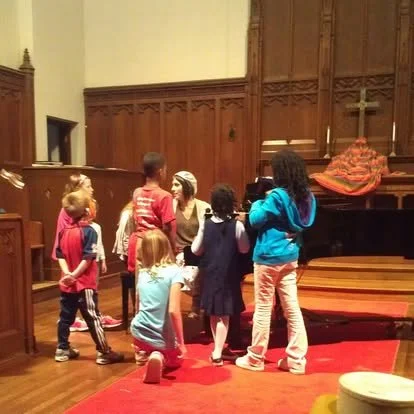 A group of students preparing for a Halloween concert, and meeting about our practice for "This is Halloween", their grand finale 