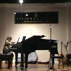 Student playing a classical concert at the Steinway Piano Gallery