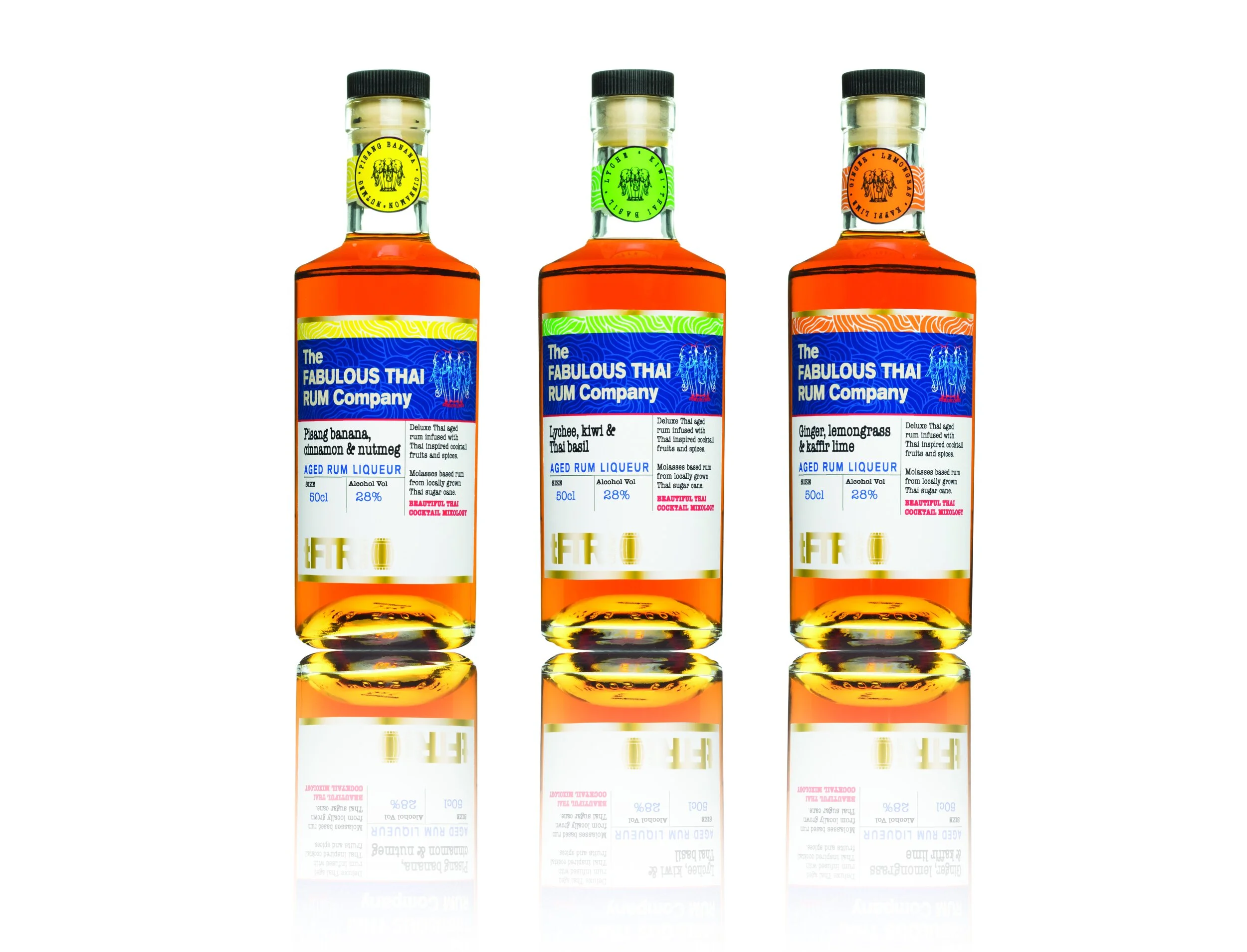Three bottles of Thai rum liqueur with colorful labels, reflected on a glossy surface, with the middle bottle slightly taller.
