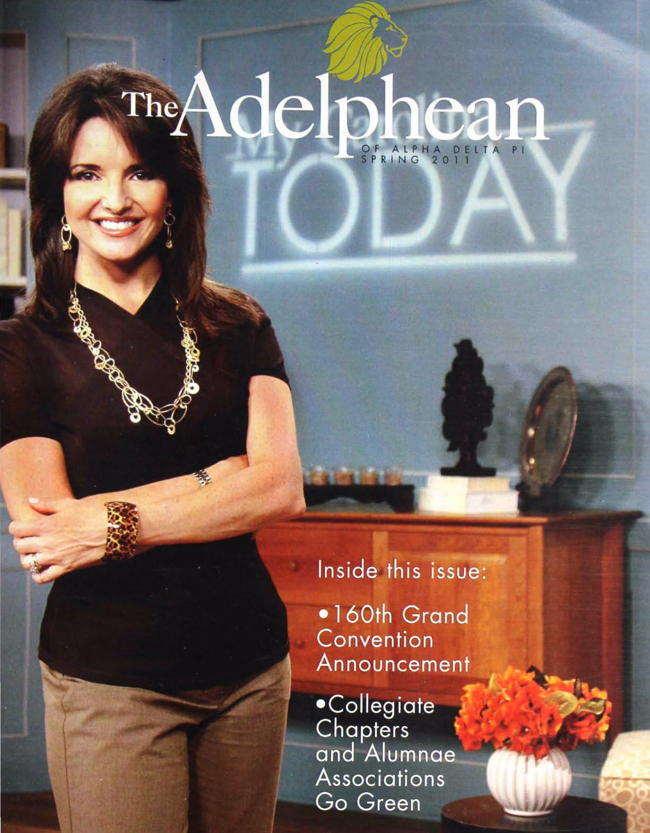 Cover of The Adelphian magazine from Spring 2011 featuring a woman in black top and beige pants, standing with arms crossed, with a blue background displaying the word "TODAY" in neon lights and a desk with a black sculpture, a mirror, and a vase of orange flowers.
