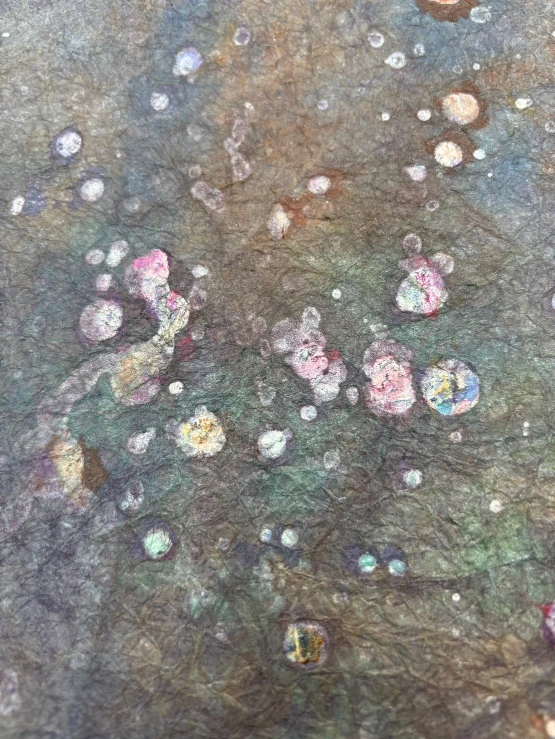 Washi paper — plant-dyed mineral foil.

Washi paper layered with vintage mineral foil and dyed with plants. This is the material in its pre-woven state — the foil will be cut into threads finer than hair and woven into silk to become Hikihaku brocade