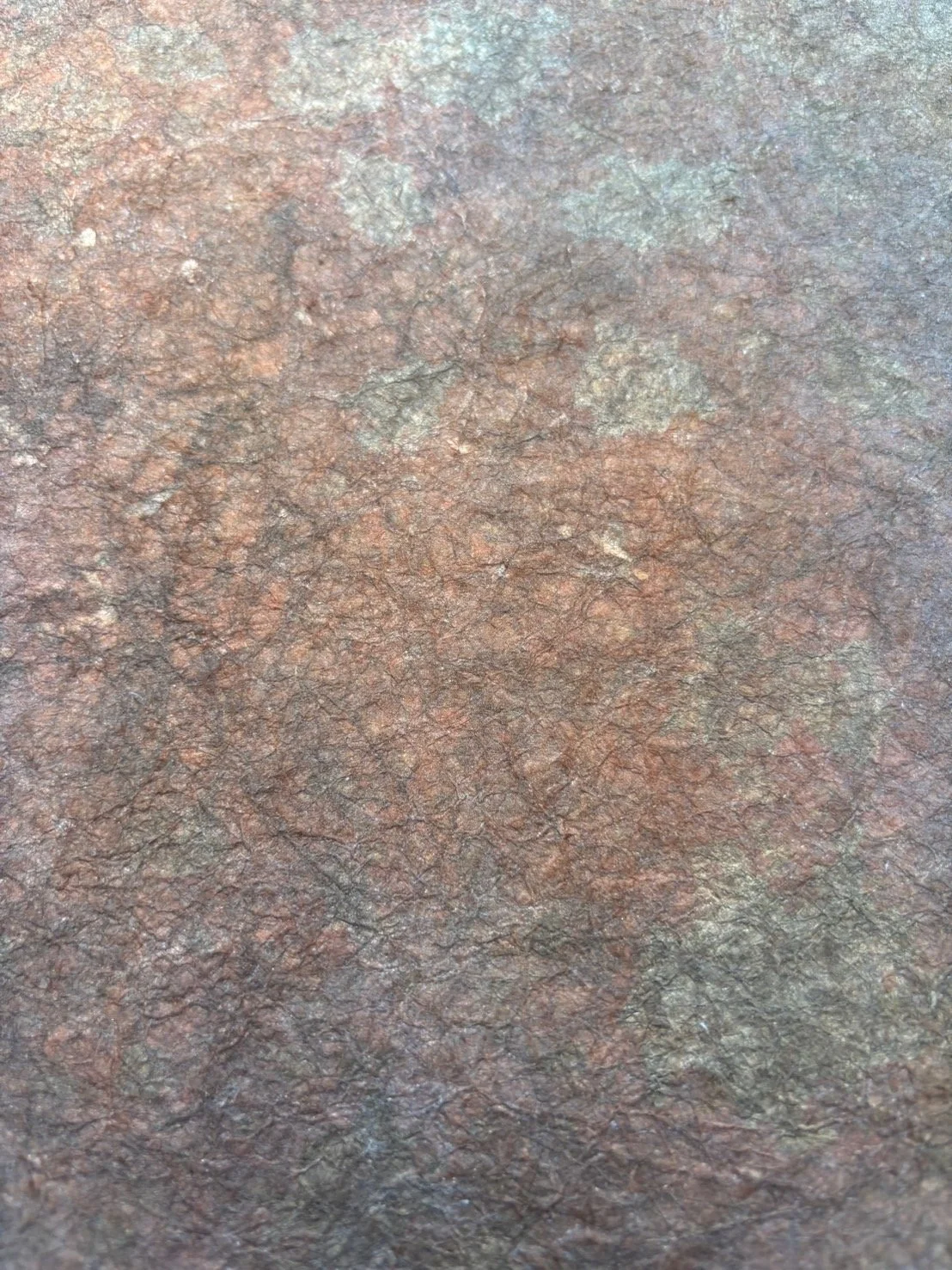 Washi paper — plant-dyed mineral foil. 

The same material, different outcome. Because each foil is dyed by hand with natural materials, variation is inherent — color shifts with the plant, the season, the water, and the age of the foil itself. What 
