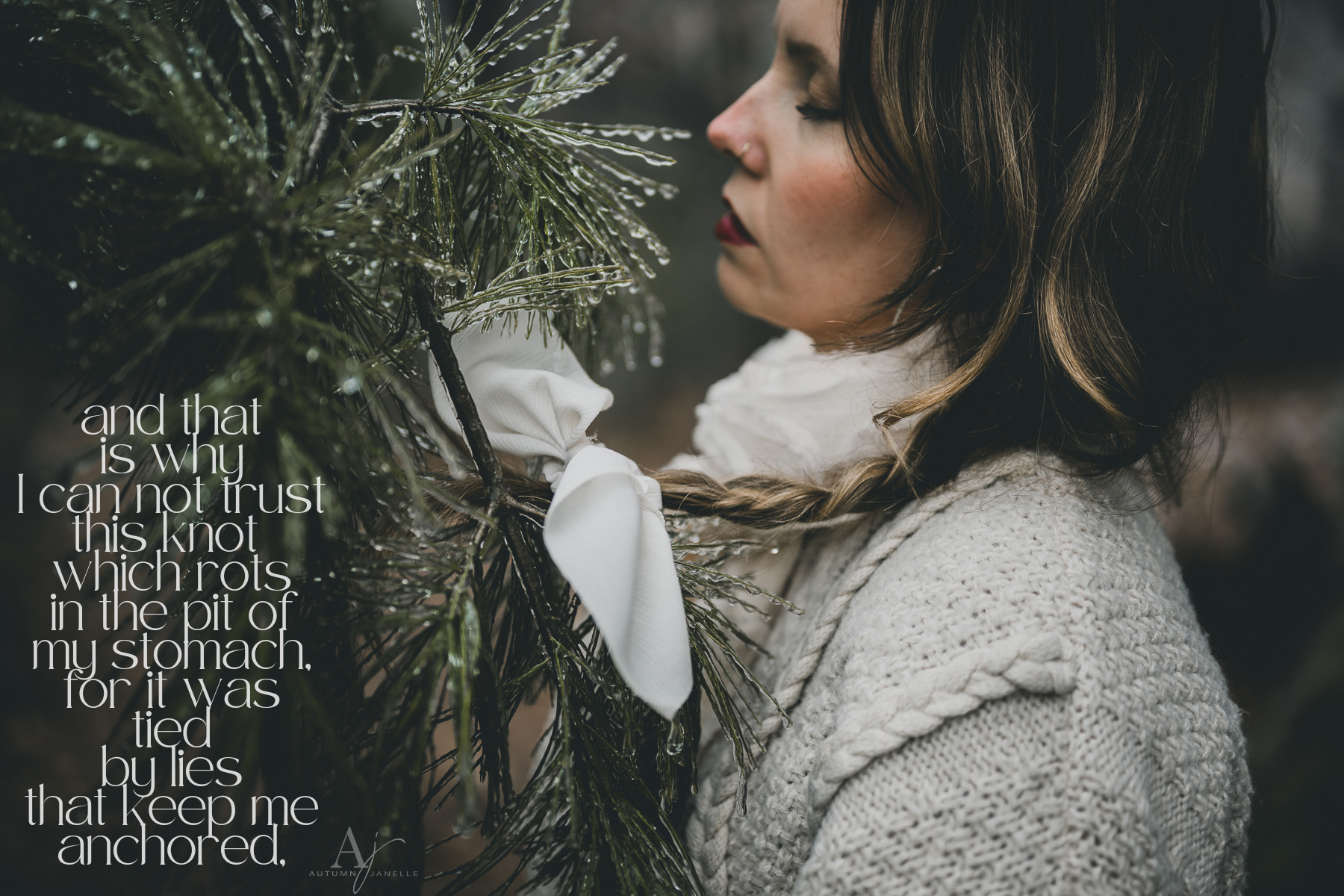 woman in cozy knit sweater in the forest with hair and bow caught in pine tree in an ice storm