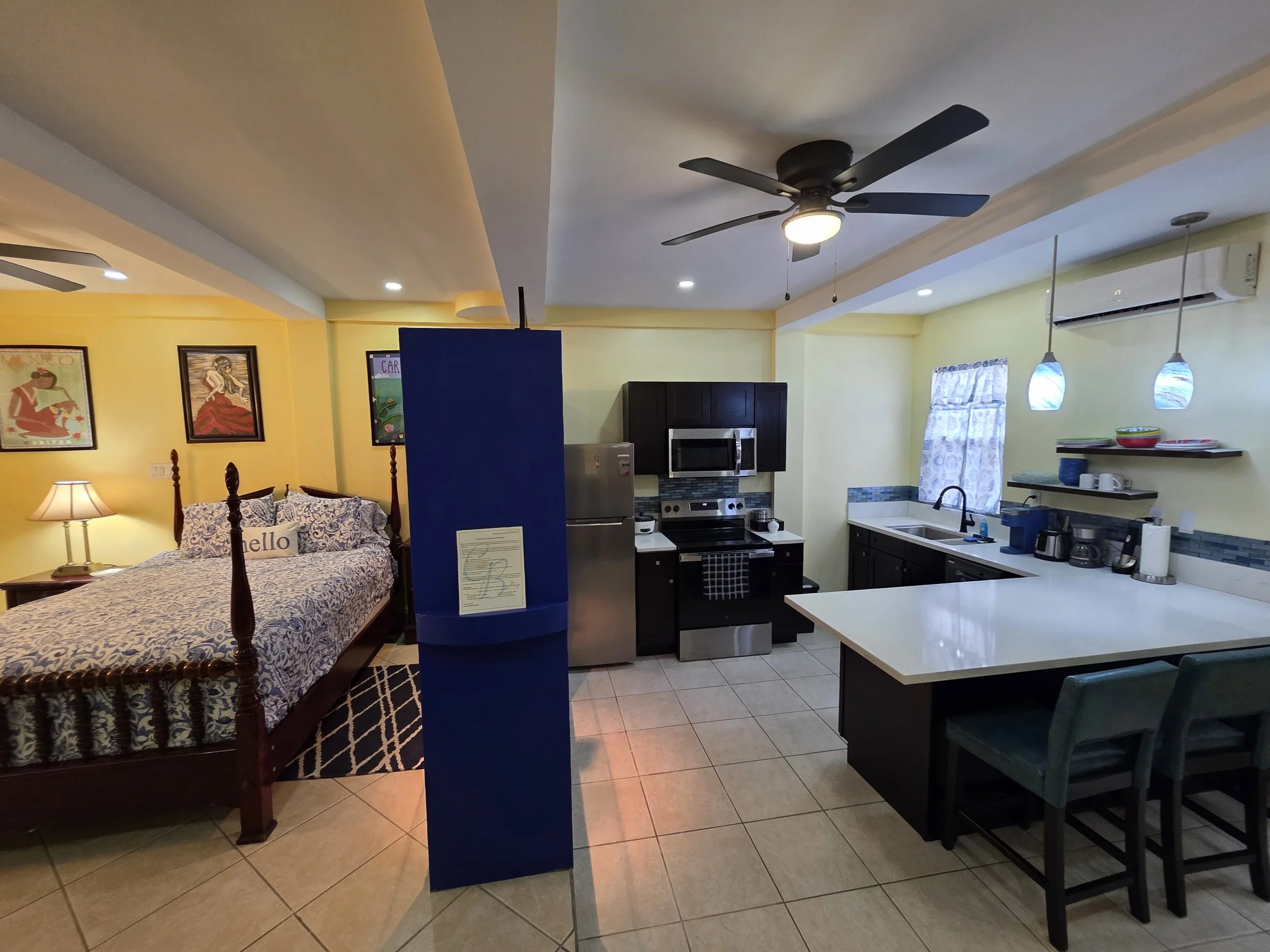 studio a casa belize airbnb bedroom kitchen.JPG