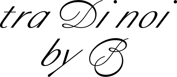 Black background with white text reading, "tra di noi".