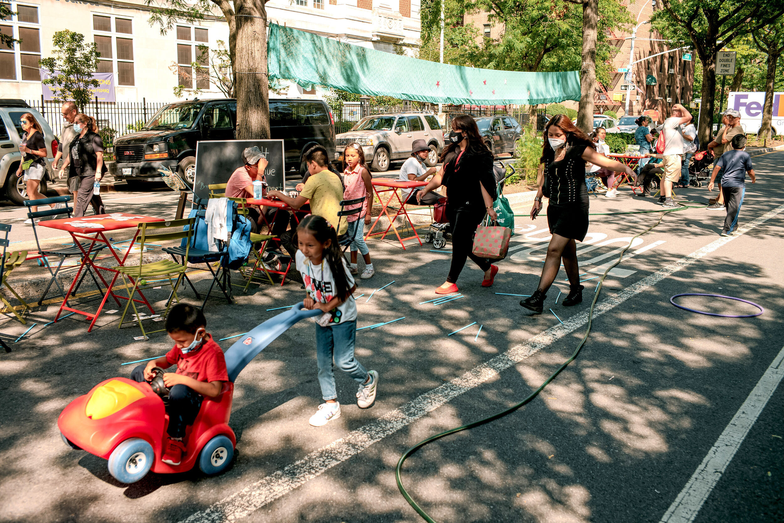 Kids run around an Open Street in Queens, New York