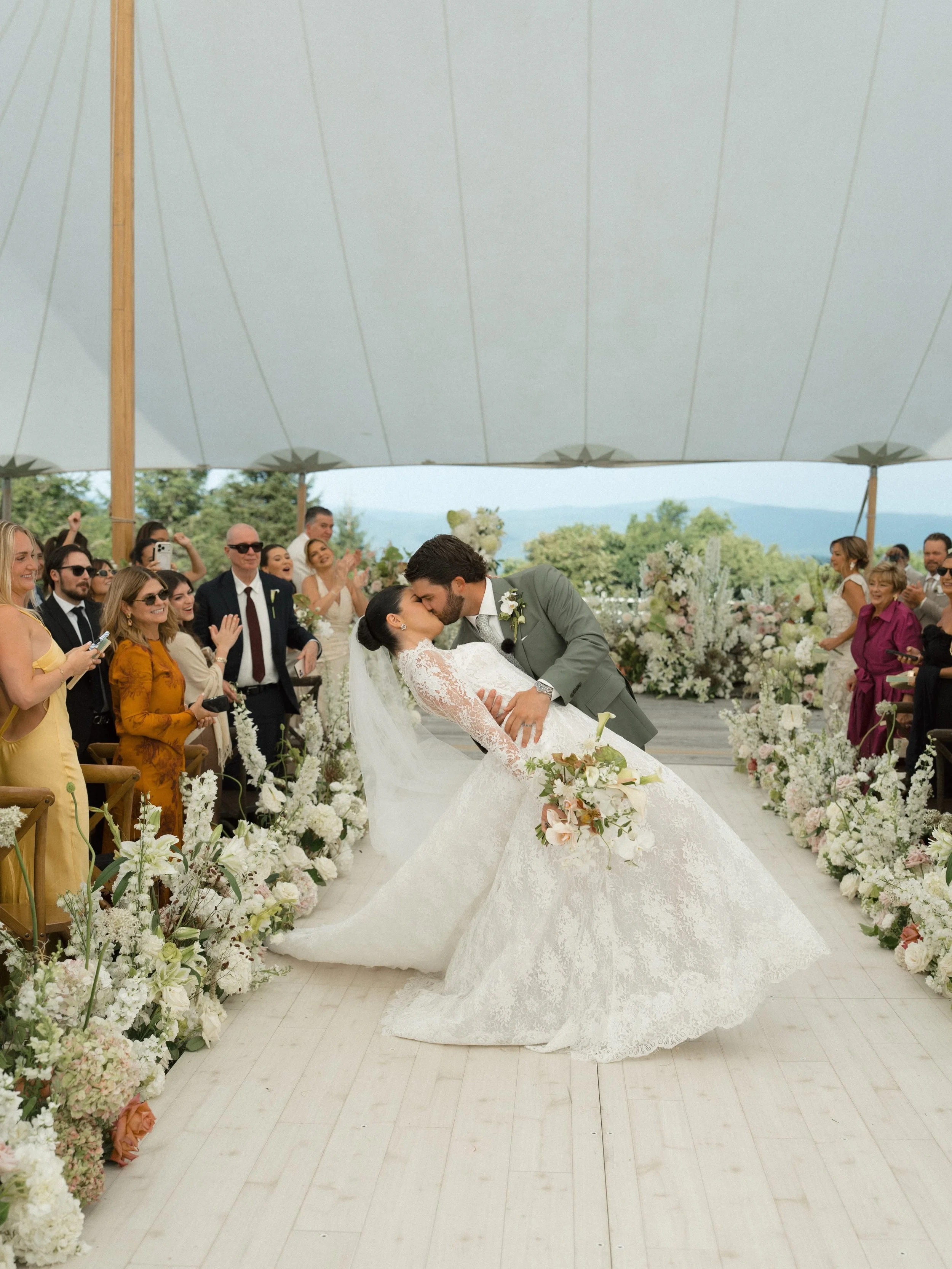 The best view was already there. Our job was to frame it.

Every design decision for this ceremony considered the mountains beyond the altar. The tent preserved the landscape, while layers of florals created a soft transition between the architecture